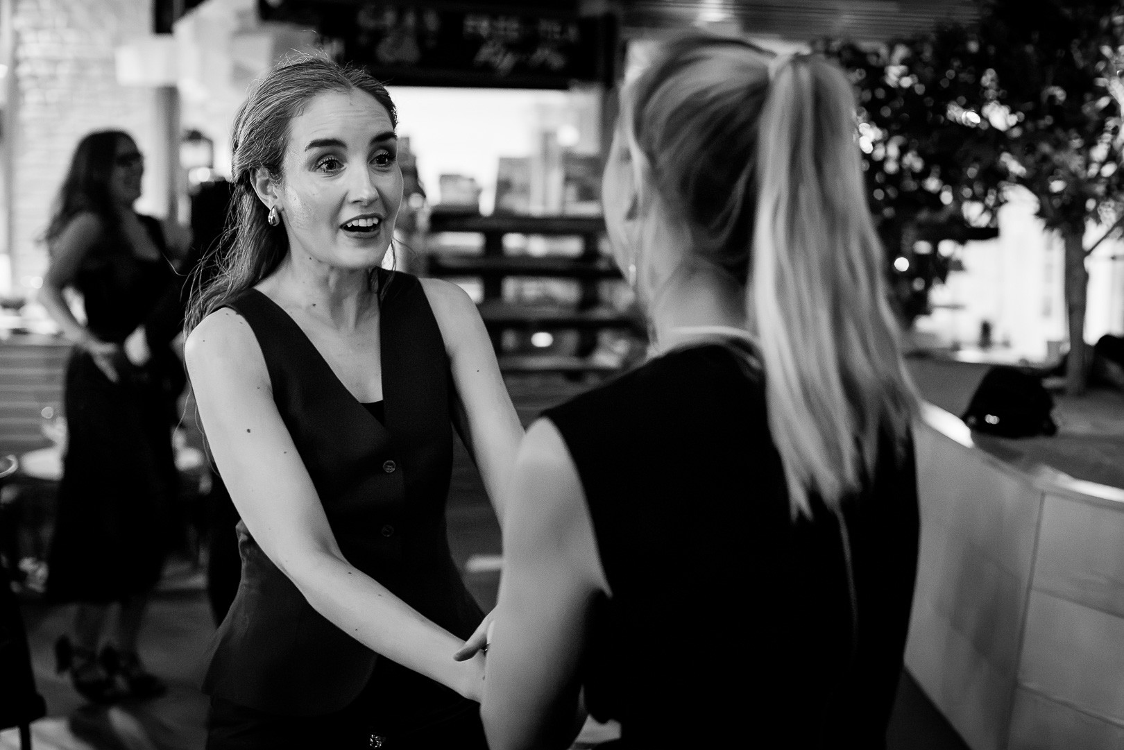 Couple laughing together mid-turn at a salsa social night