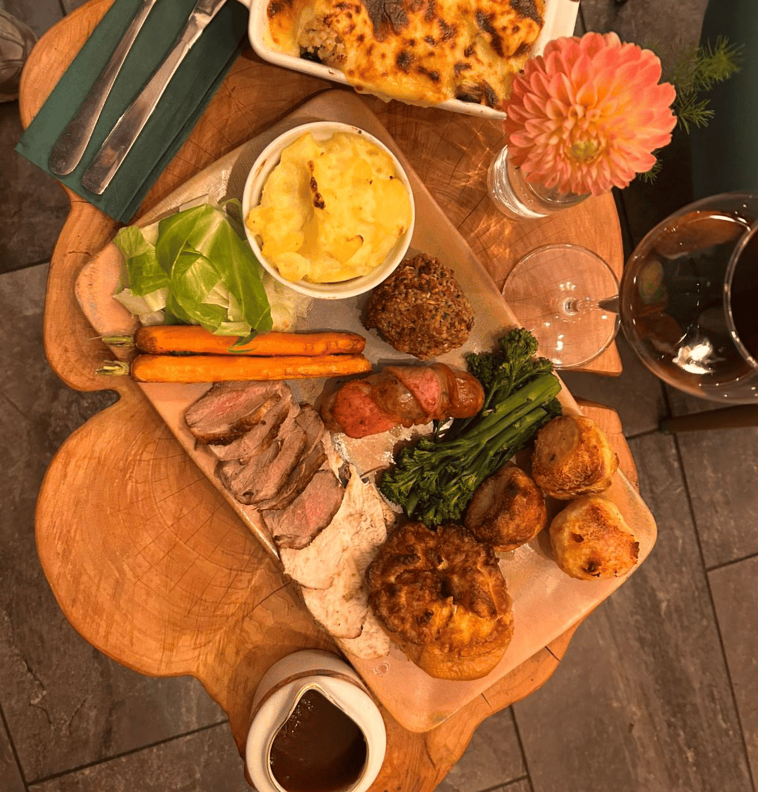 A Dovecote Sunday roast with roast potatoes, vegetables and Yorkshire pudding