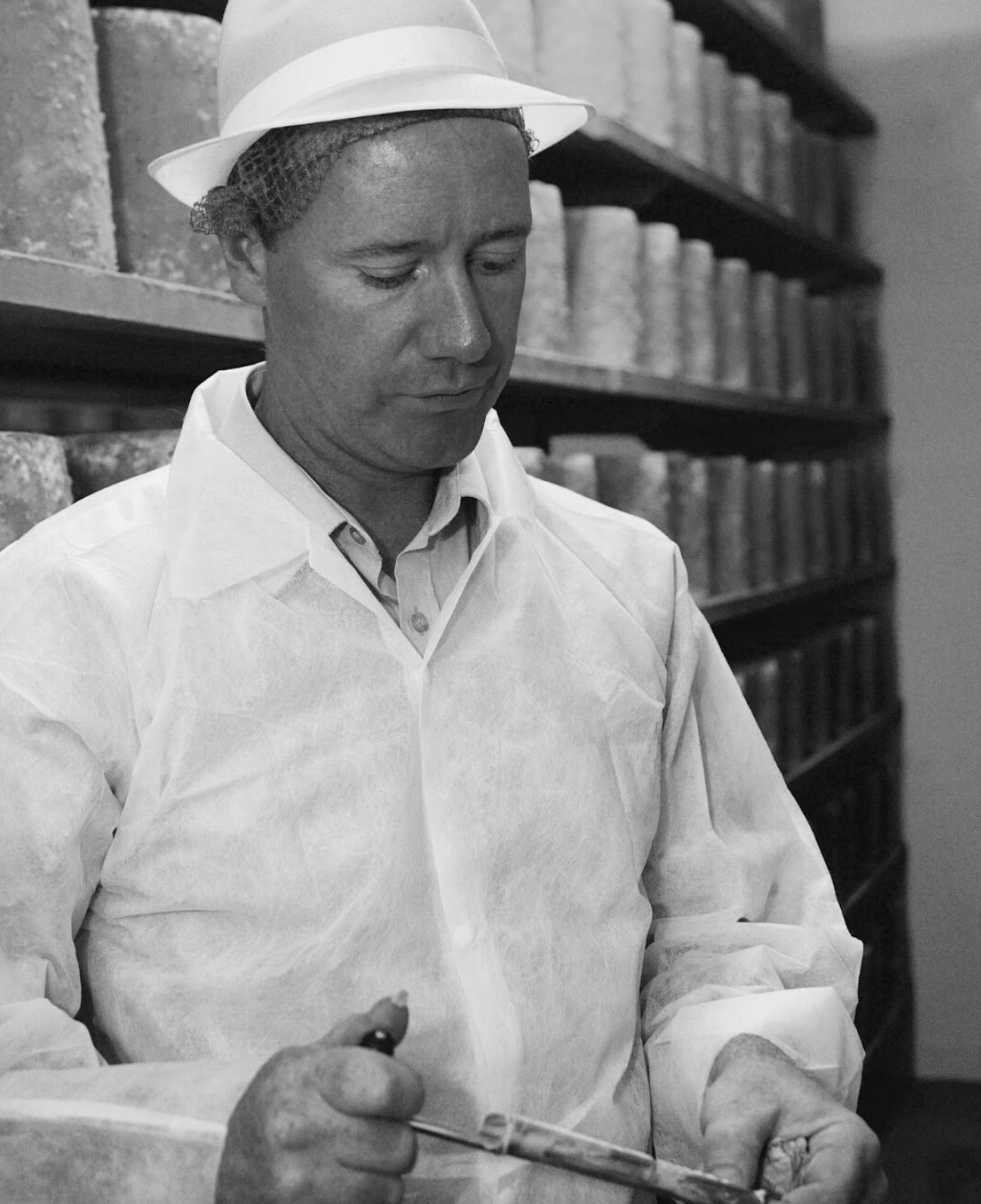 Colston Bassett Dairy cheesemaker at work