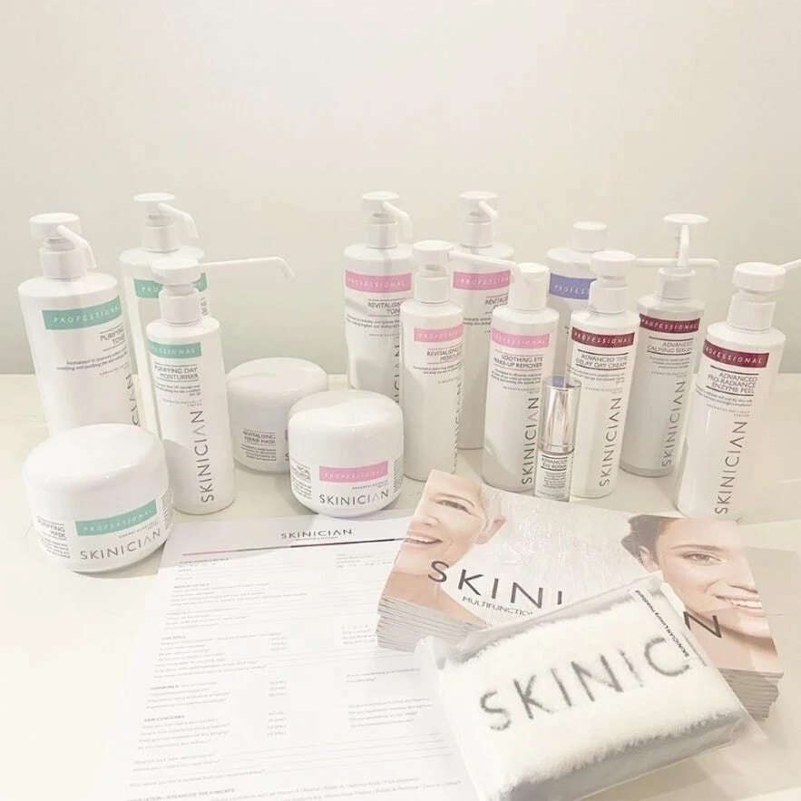 Skinician skincare products including glycolic toner, hyaluronic elixir, retinol balm, and moisture gel