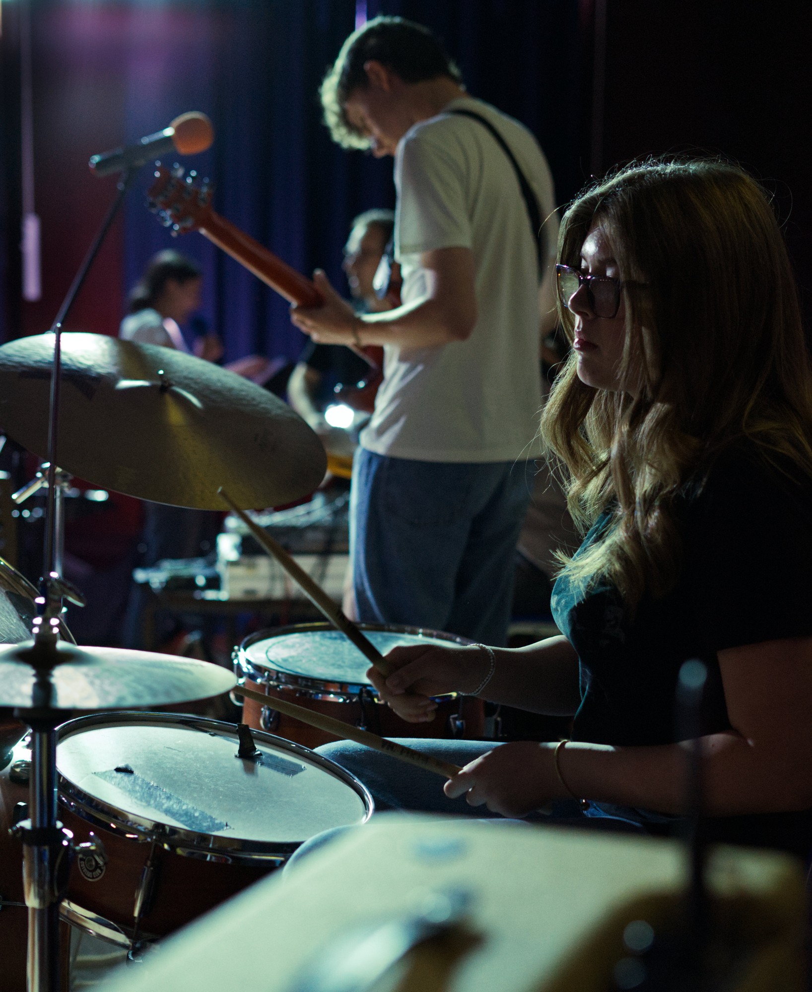 Young guitar student focused on playing at Rock Now