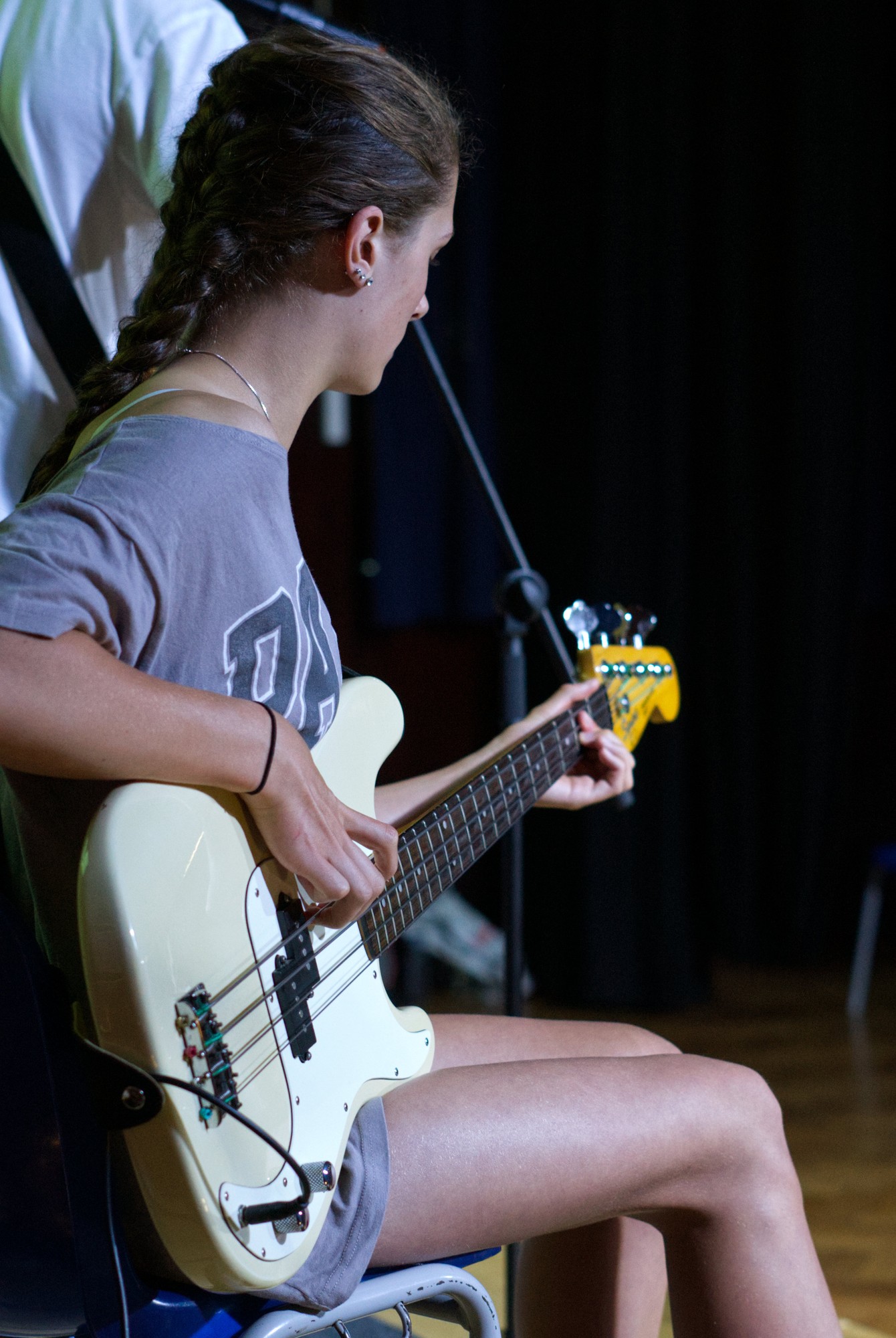 Young drummer mid-performance at Rock Now Music Academy