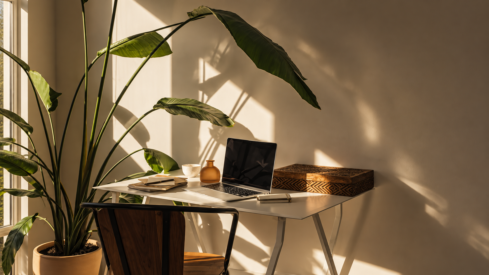 Laptop displaying a professional website on a warm wood table
