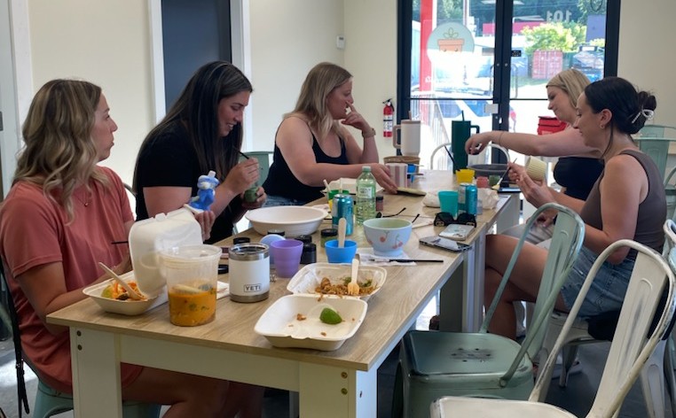 Friends hand-building with clay together in the studio