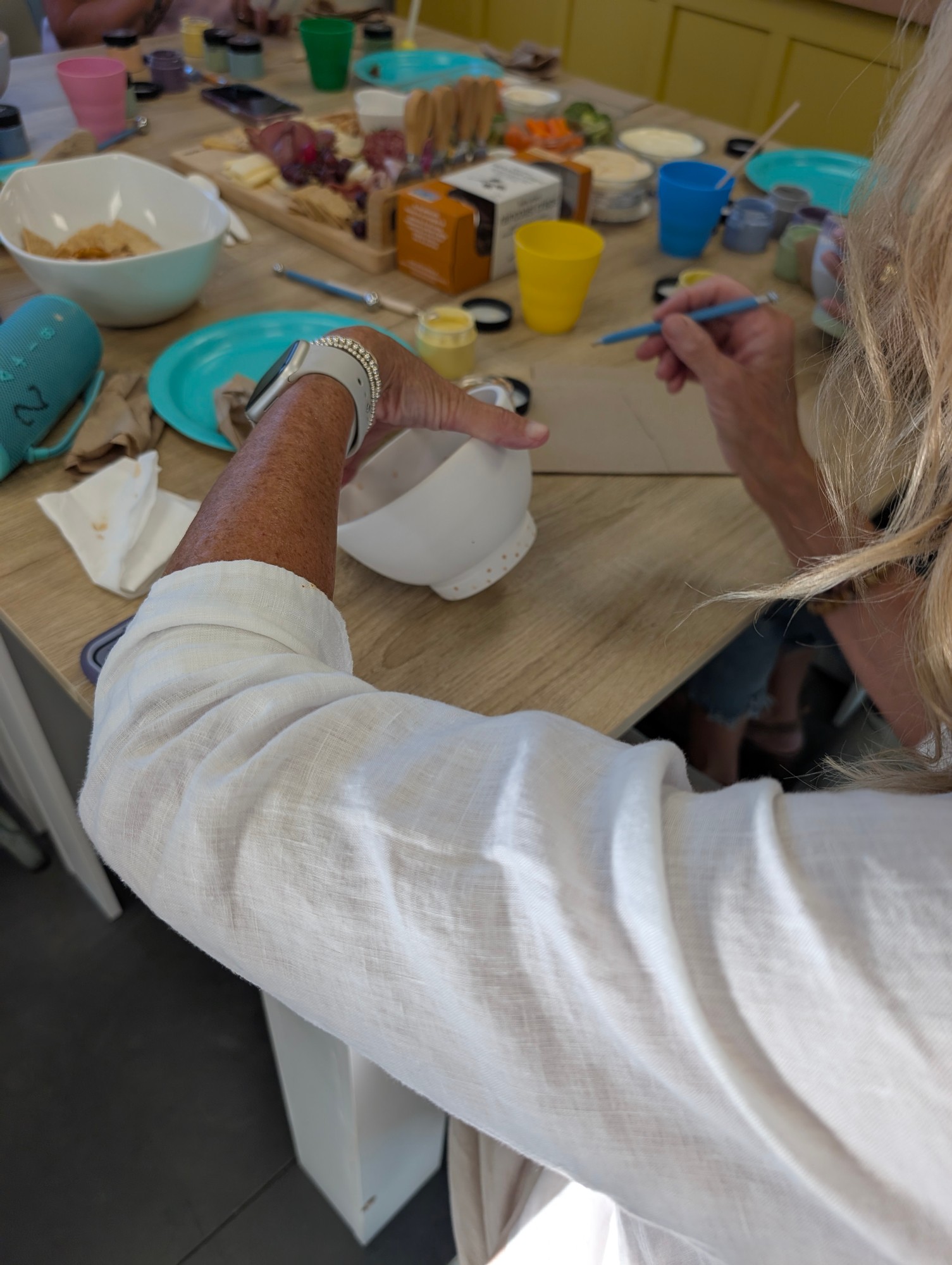 Ceramic pieces ready to be painted at a party
