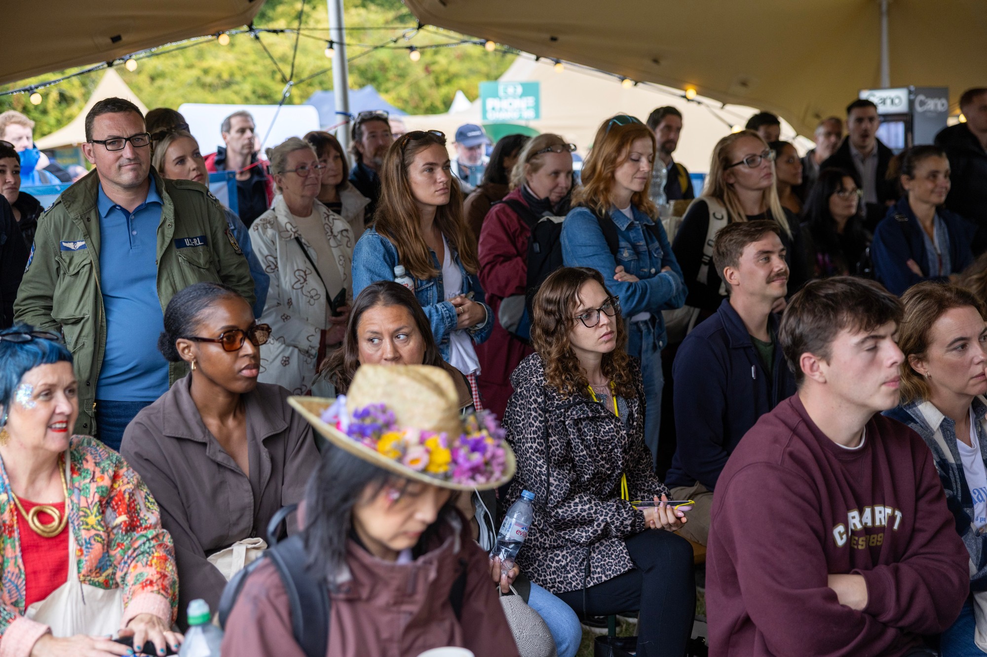 A vibrant crowd cheering at Ideas Fest