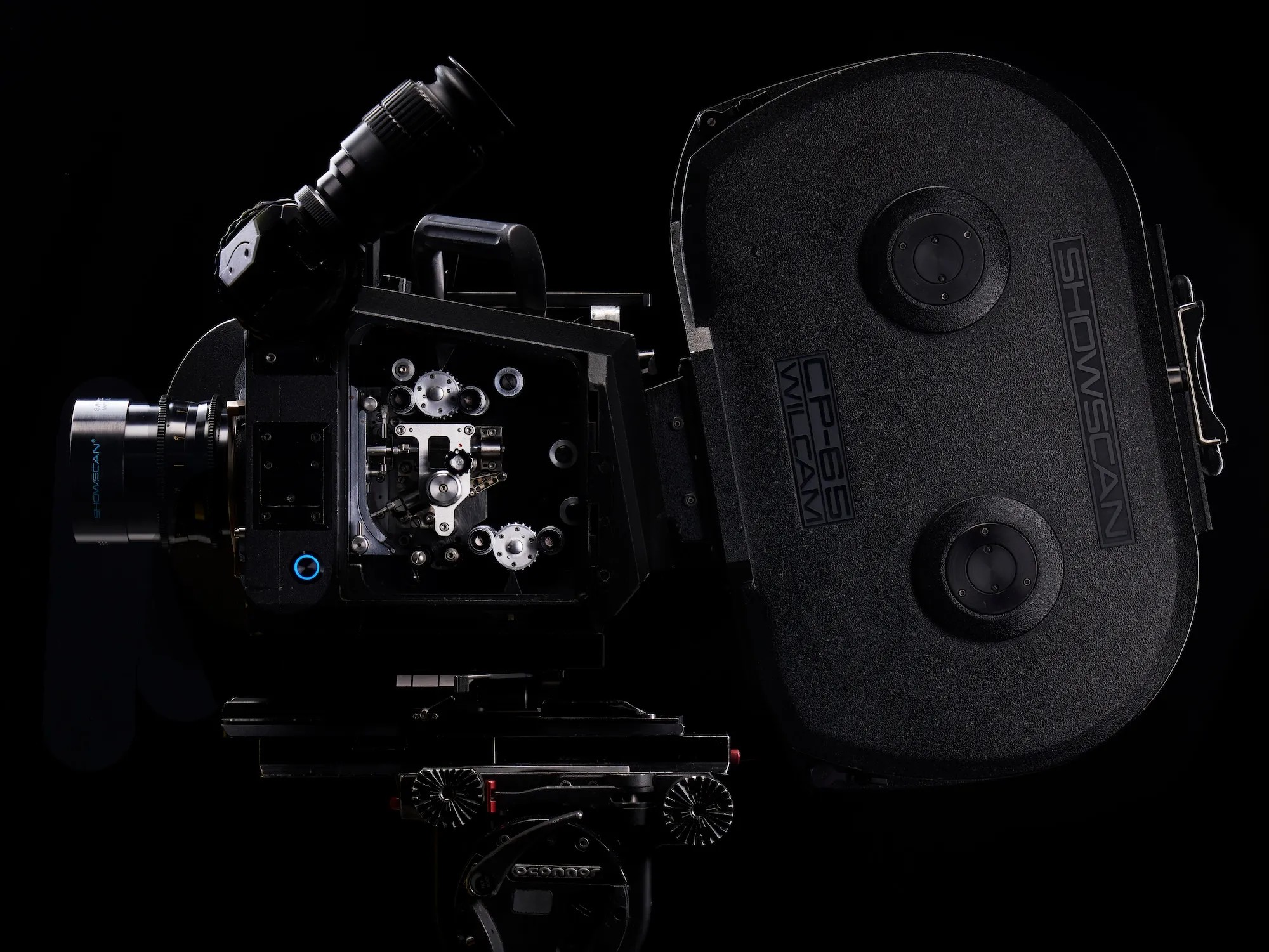 Rear view of a CP-65 camera with the twin reel hubs of its magazine visible