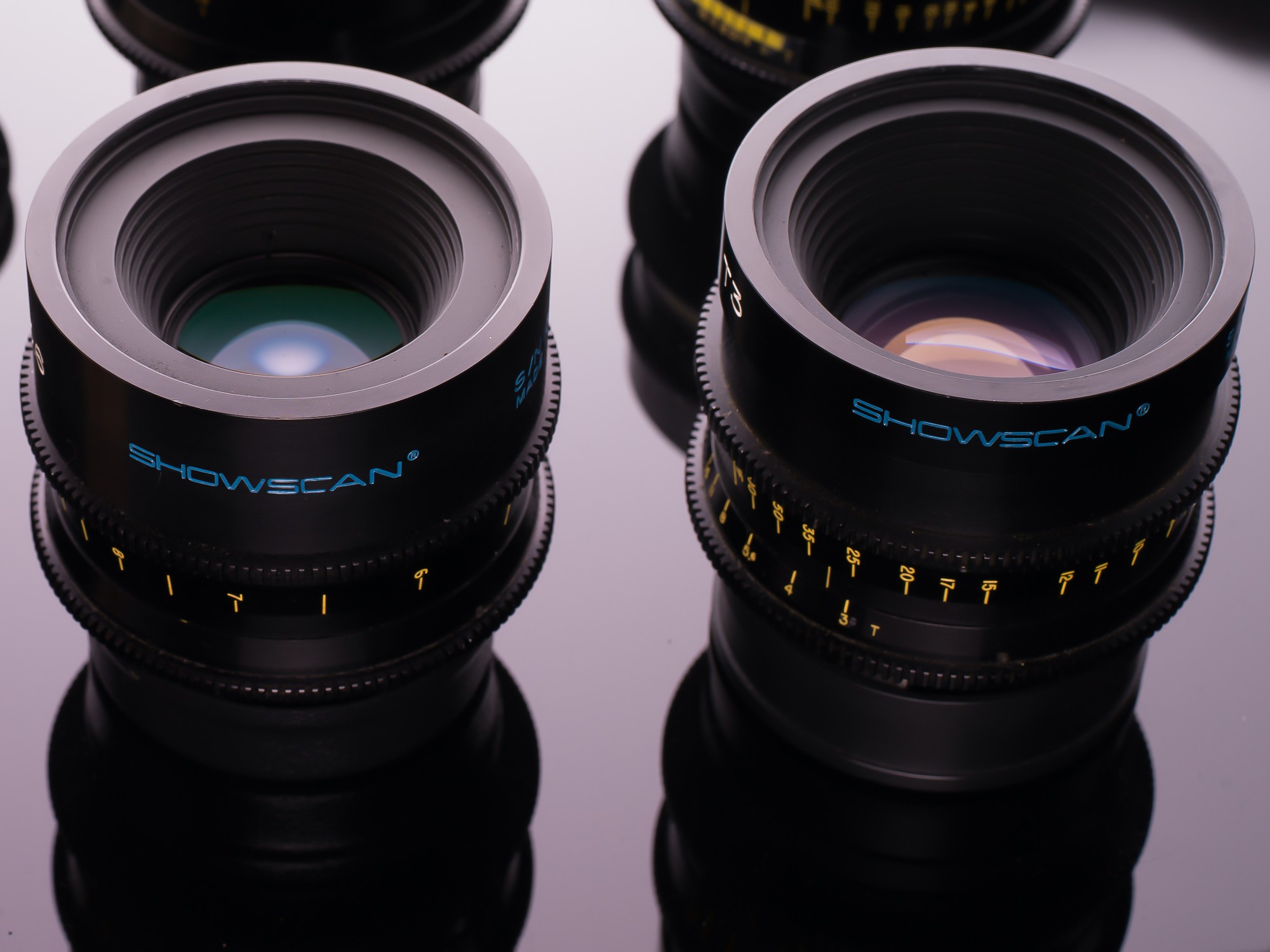 Six Showscan lenses arranged on a reflective black surface