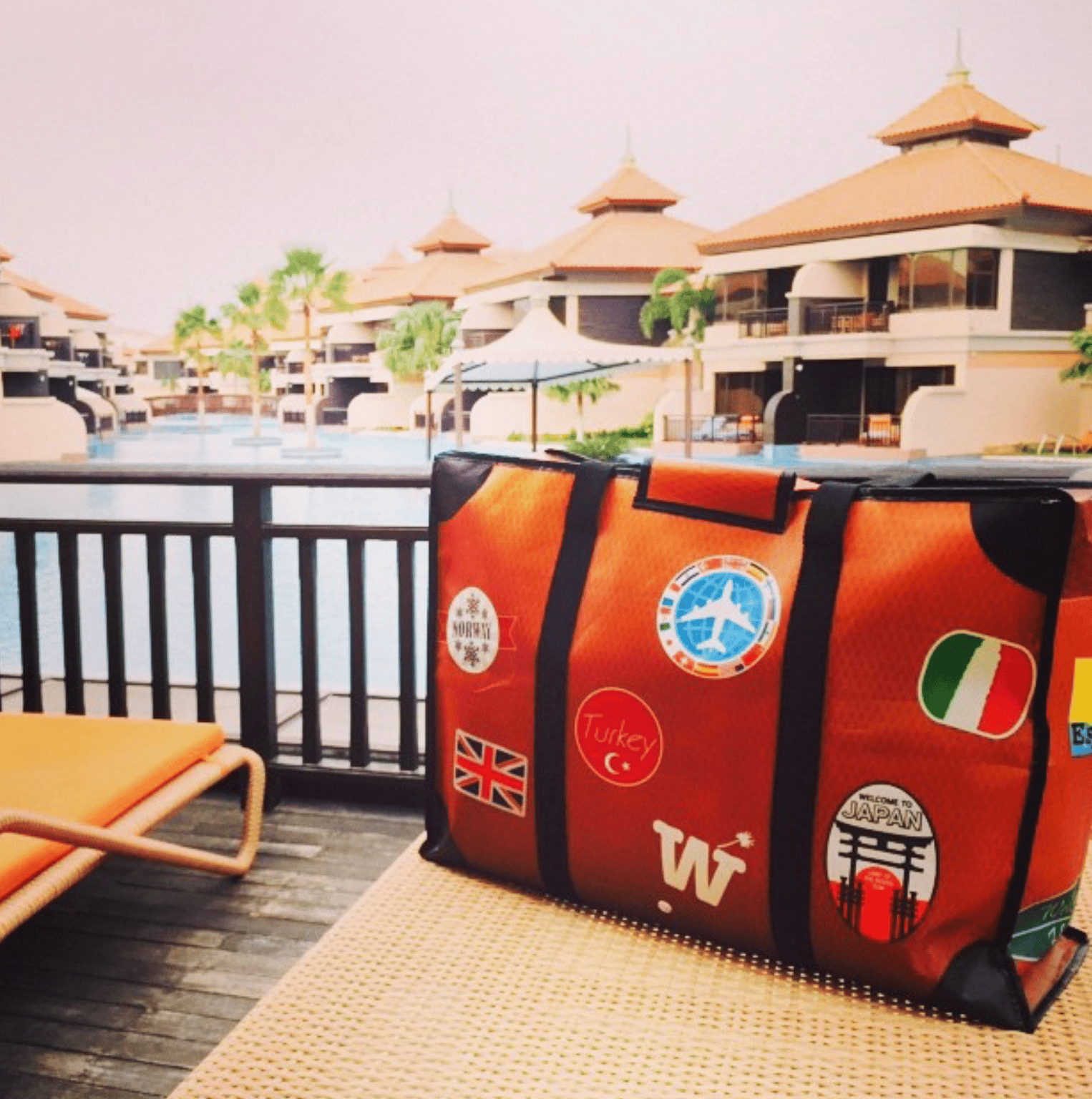 WISSHH Travel Bag in the vintage orange travel-stickers edition, on the road