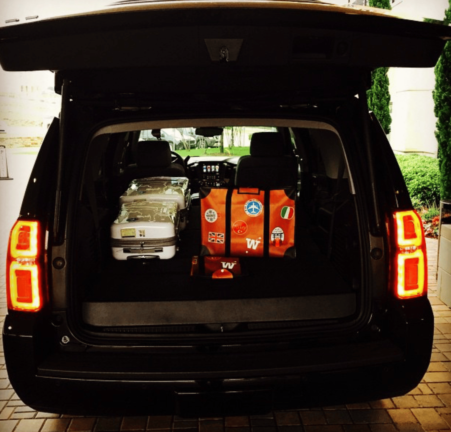 WISSHH Travel Bag in the vintage orange travel-stickers edition, on the road
