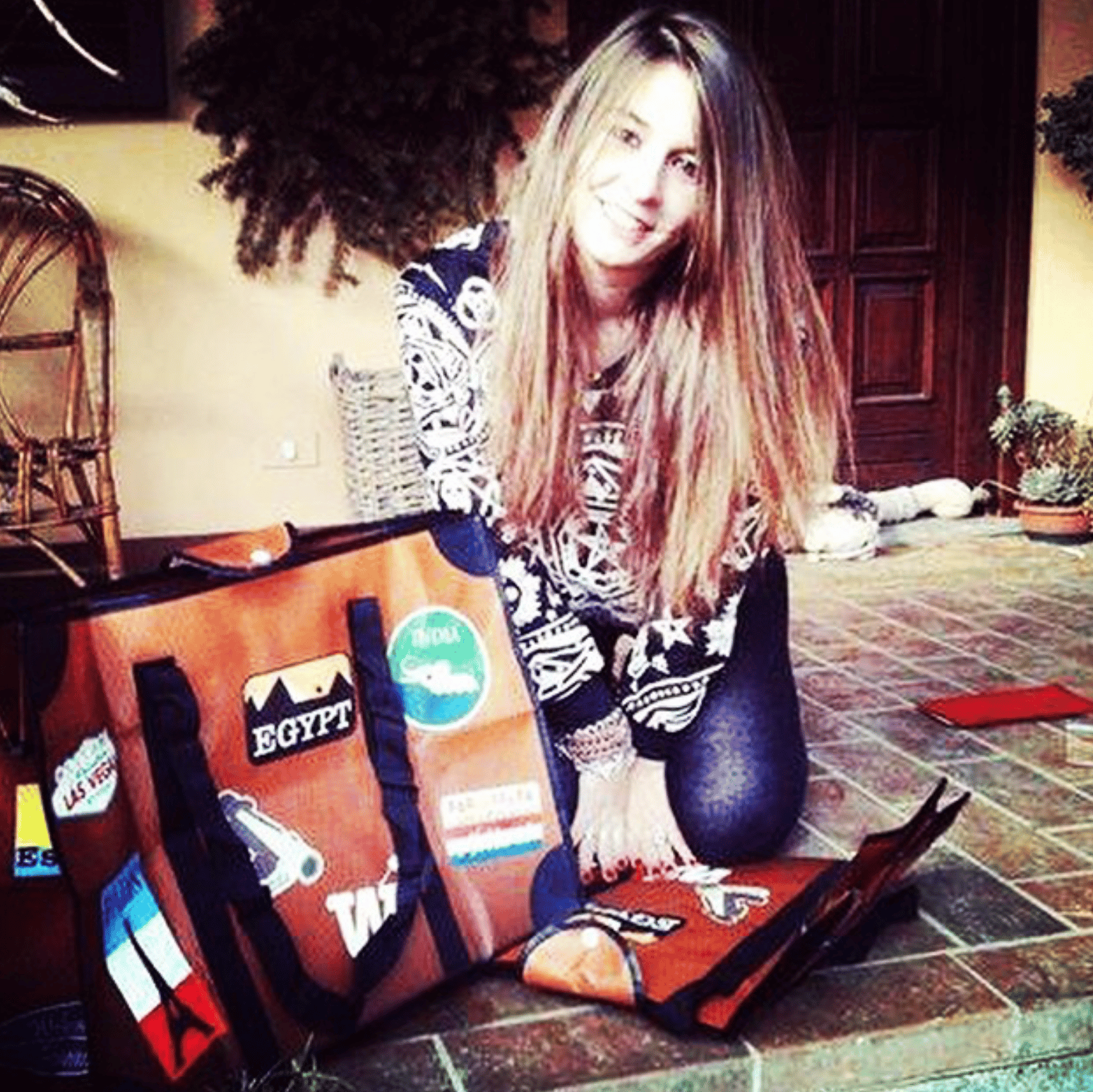 WISSHH Travel Bag in the vintage orange travel-stickers edition, on the road