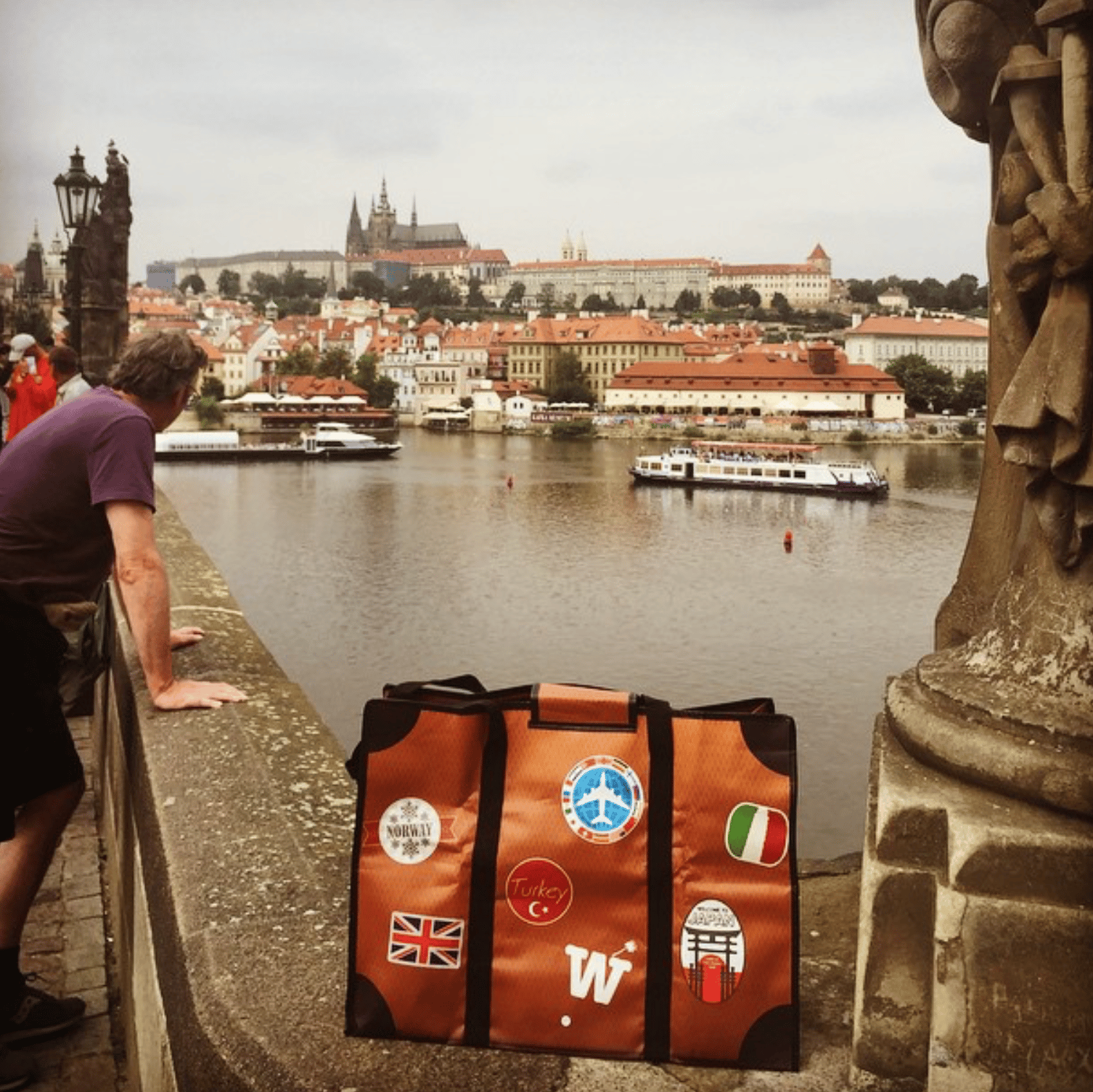 WISSHH Travel Bag in the vintage orange travel-stickers edition, on the road
