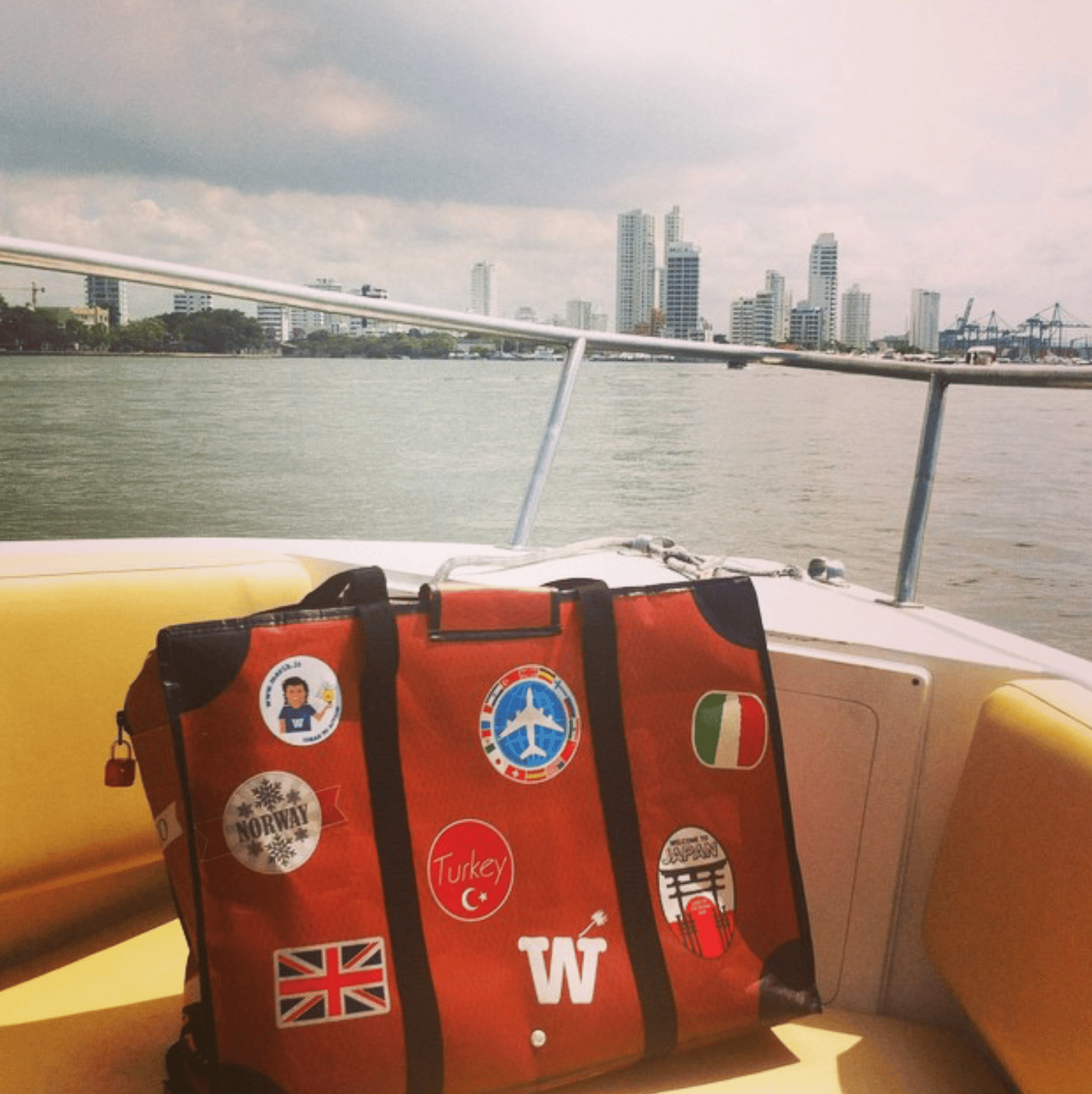 WISSHH Travel Bag in the vintage orange travel-stickers edition, on the road