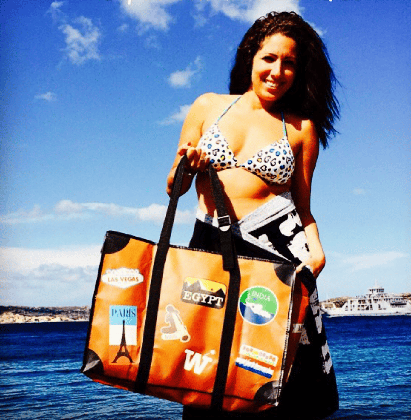 WISSHH Travel Bag in the vintage orange travel-stickers edition, on the road