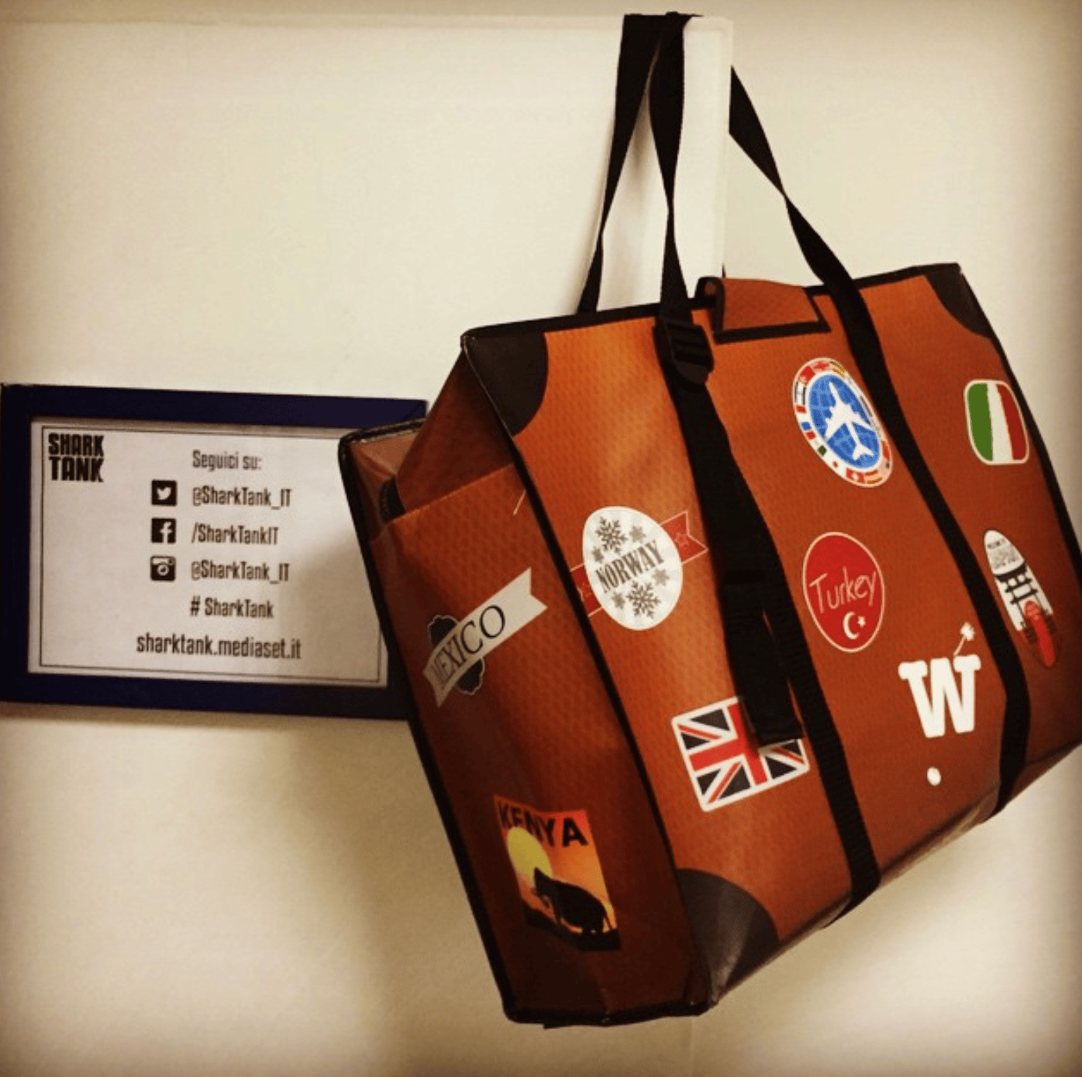 WISSHH Travel Bag in the vintage orange travel-stickers edition, on the road