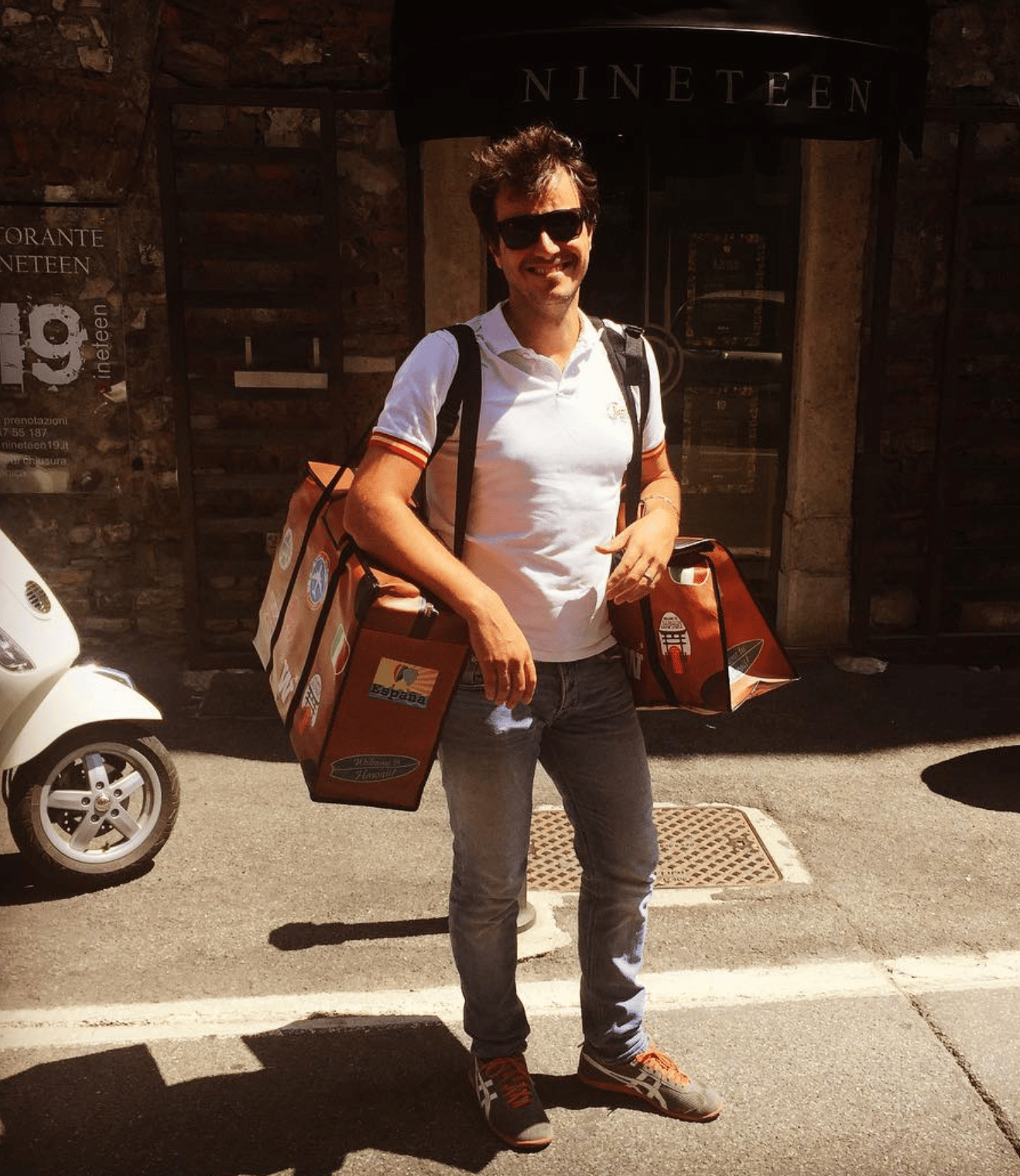 WISSHH Travel Bag in the vintage orange travel-stickers edition, on the road