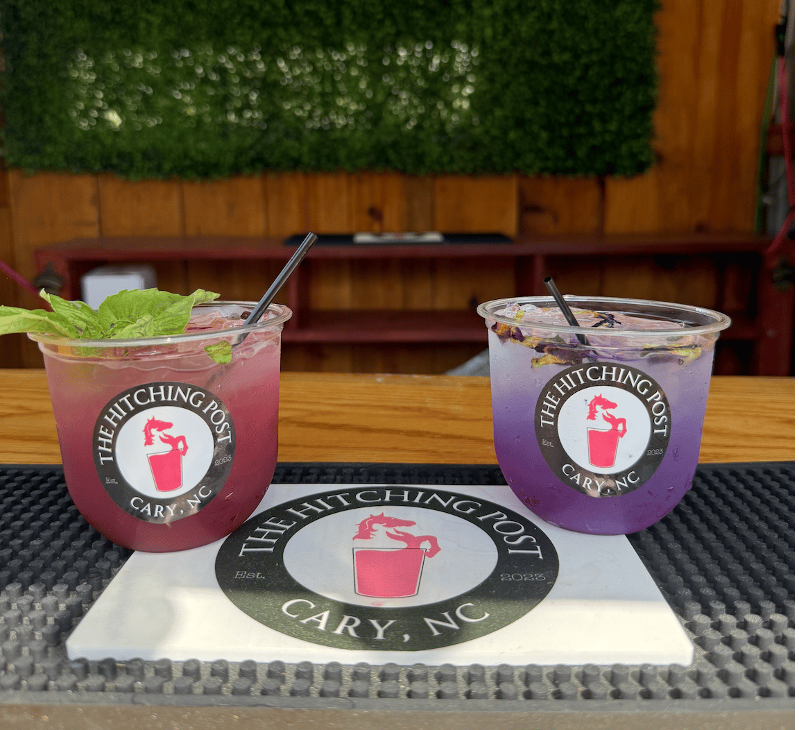 Two signature Hitching Post cocktails on the bar top at a corporate event