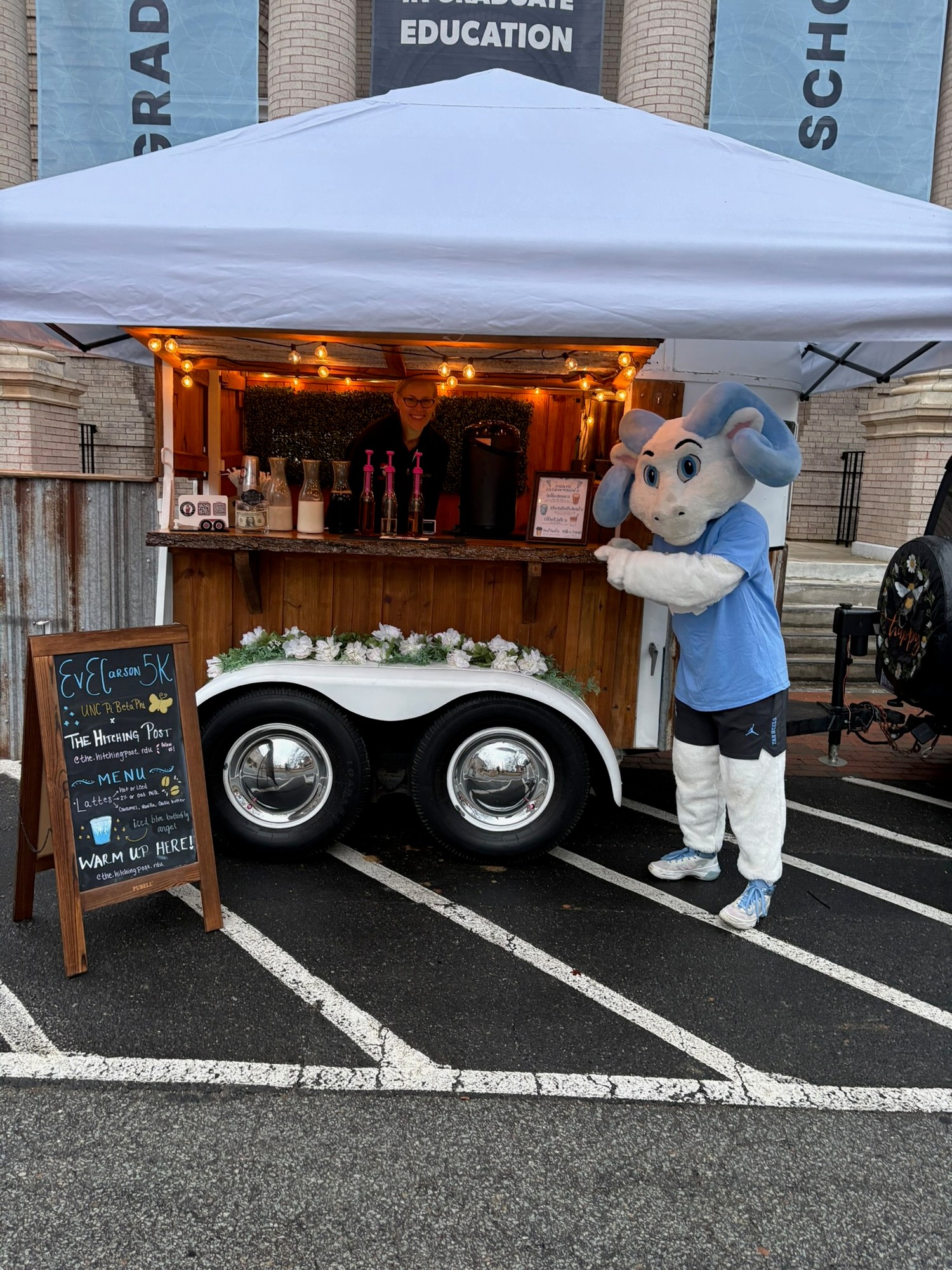 Rameses the UNC mascot visiting The Hitching Post trailer at the Pi Beta Phi Eve Carson Memorial 5K