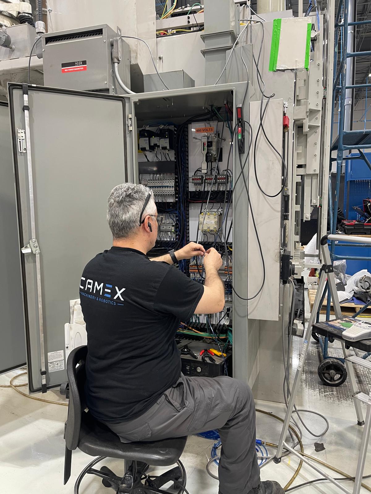 Camex technician wiring the control cabinet