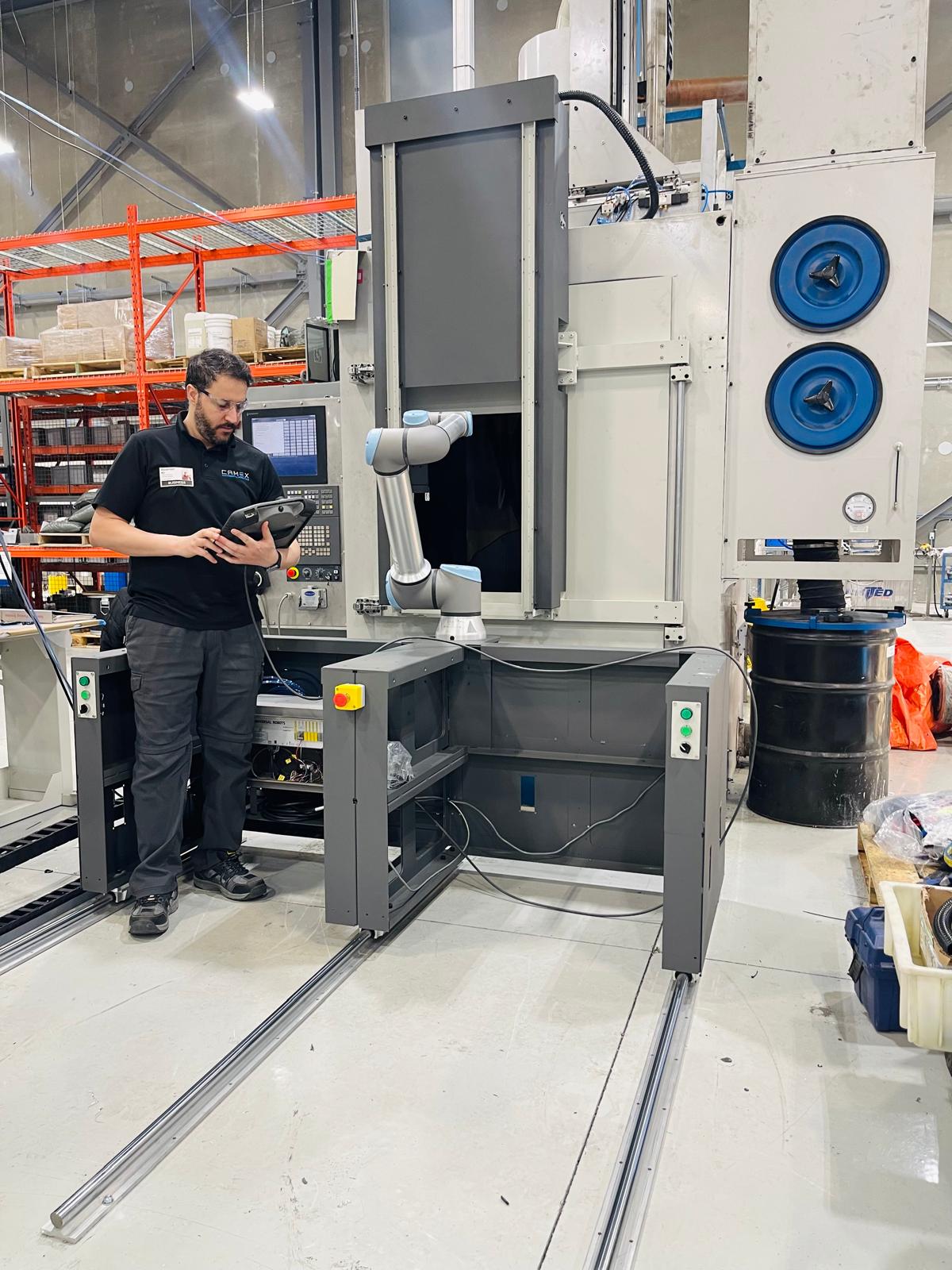 Camex technician programming the cobot with teach pendant
