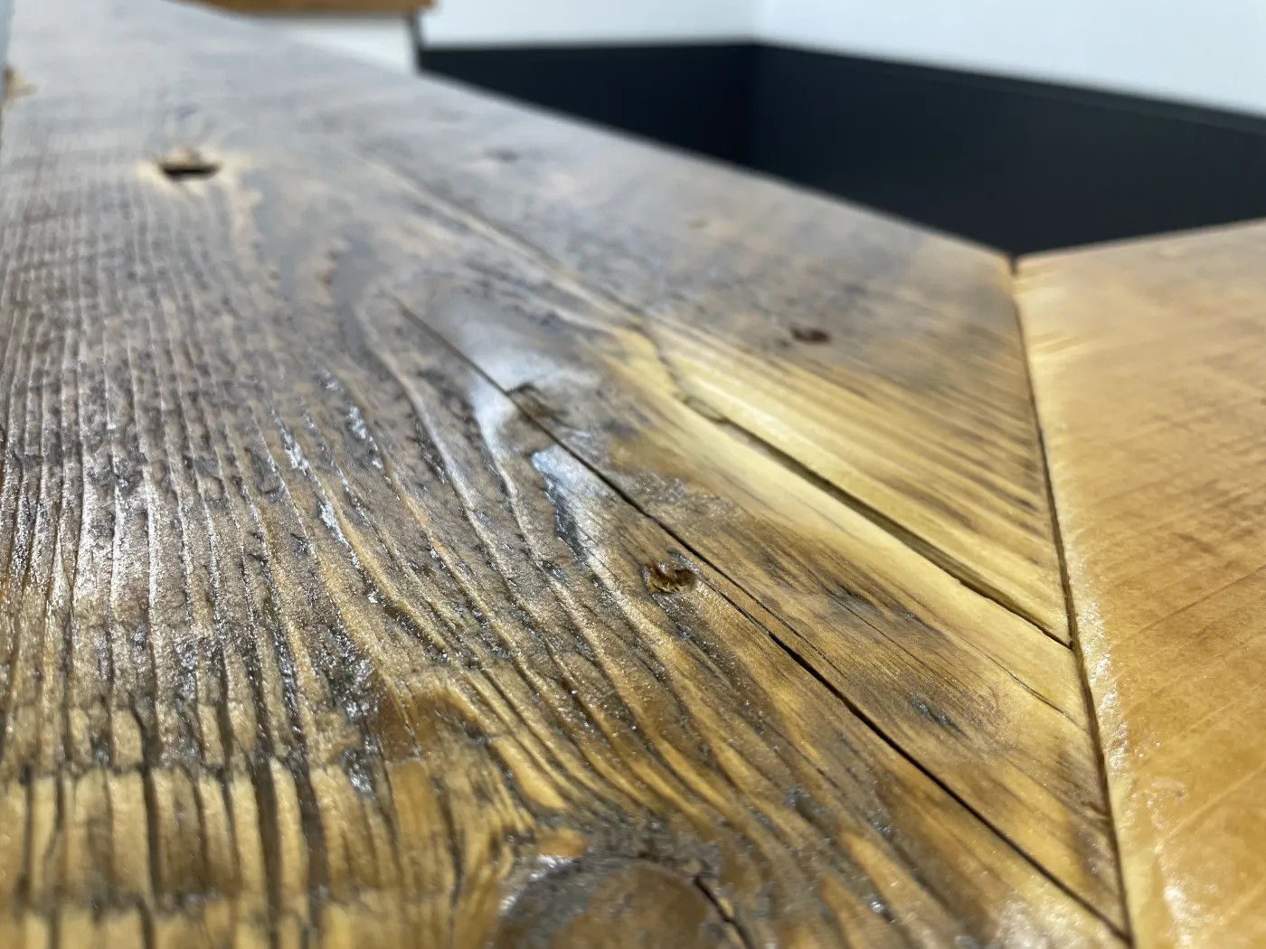 Close-up of the natural grain and hand-finished surface of the bar