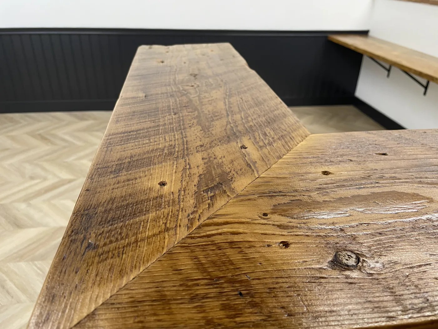 Close-up of the fitted angled joint in a custom wood bar