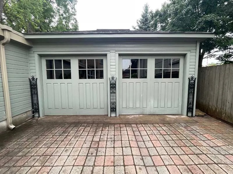 Professional exterior house painting with ladder