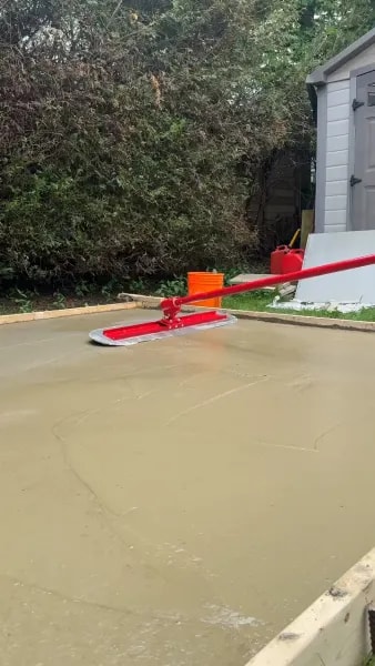 Completed concrete slab being power-floated to a smooth surface