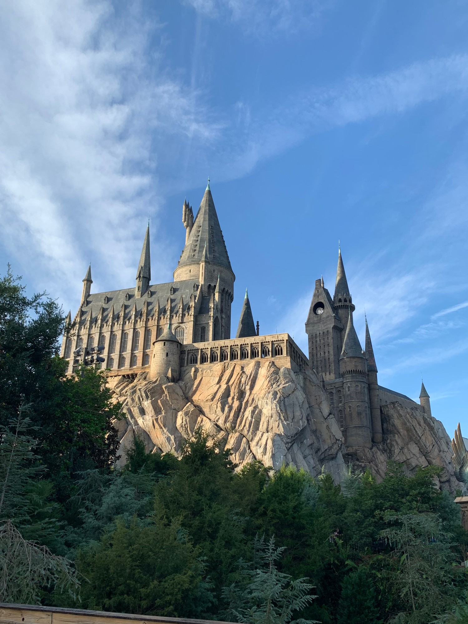 Hogwarts Castle at the Wizarding World of Harry Potter, Universal Orlando, against a blue sky