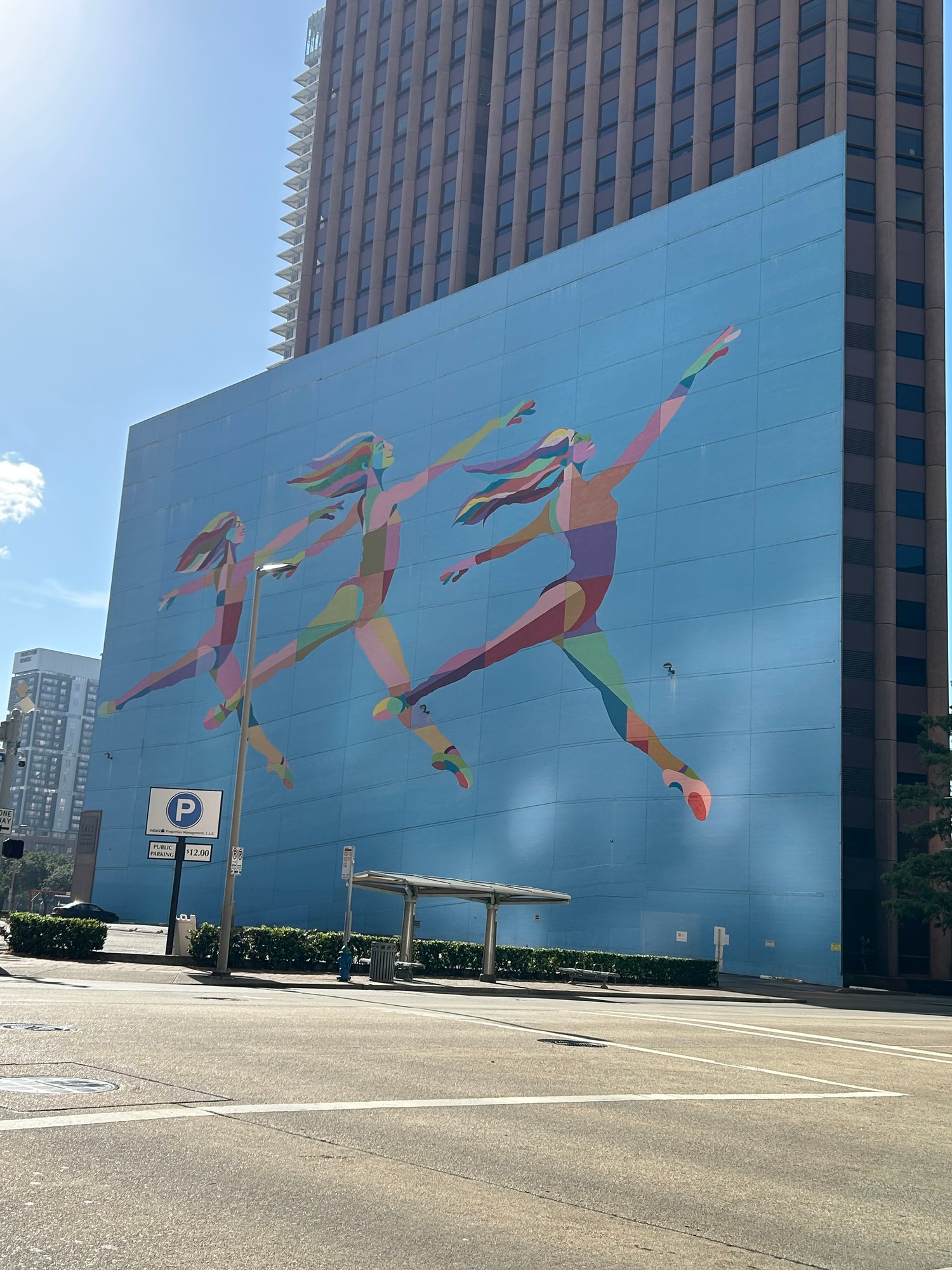 A colourful mural of dancing figures in downtown Houston