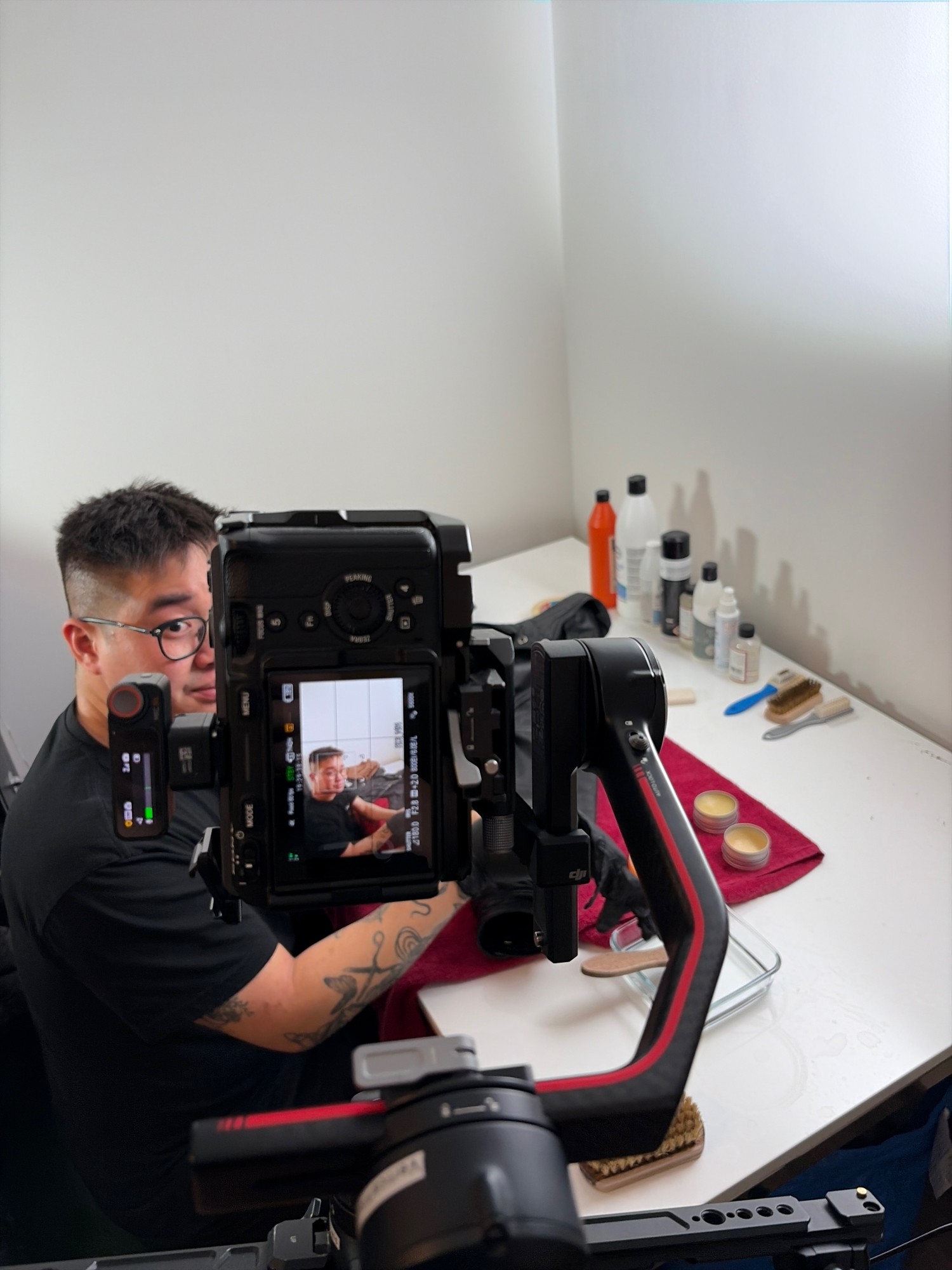 Videographer filming Penguin Online content in studio