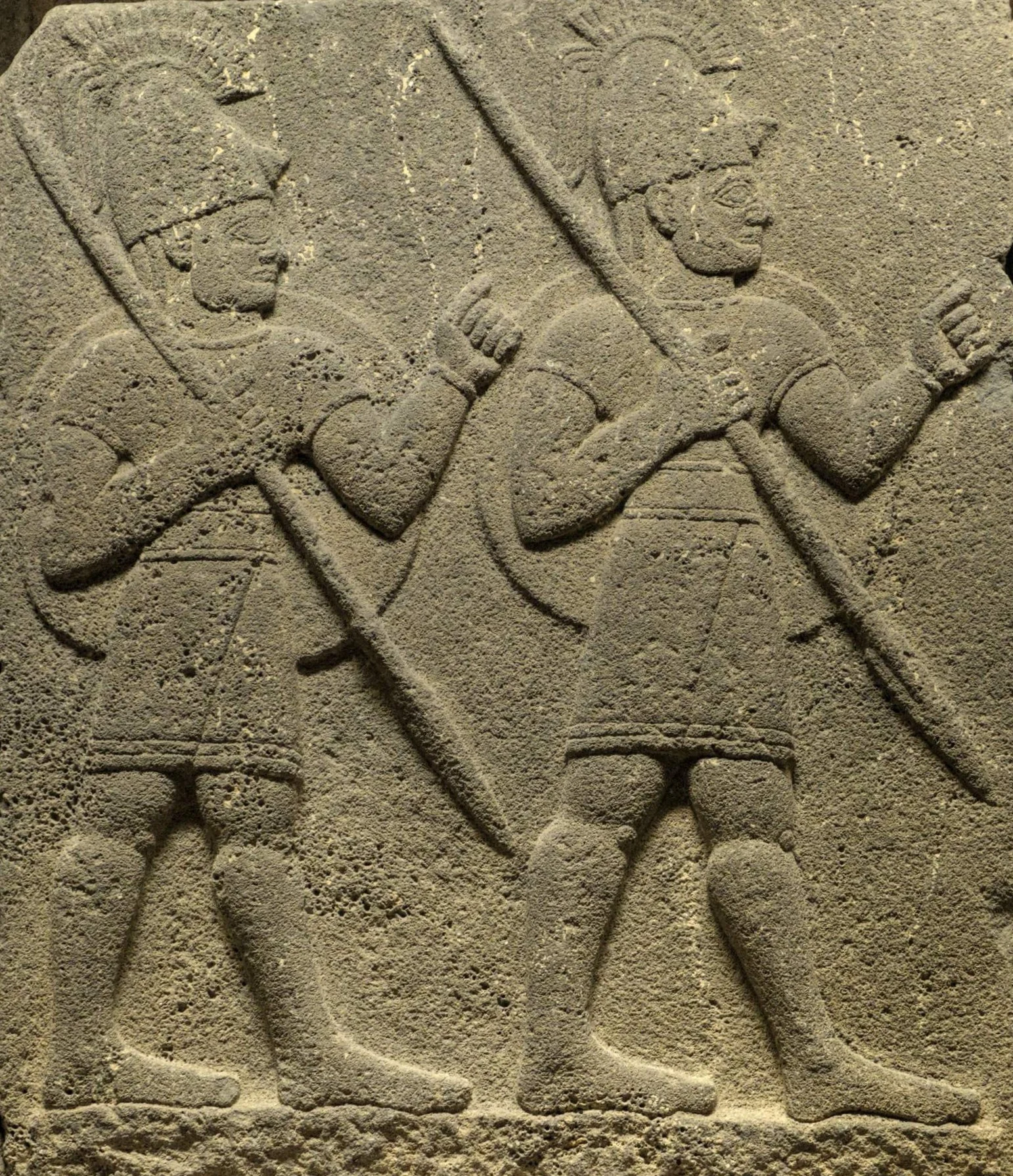 Carchemish basalt relief showing several armed, helmeted figures in procession, a Neo-Hittite-style carving