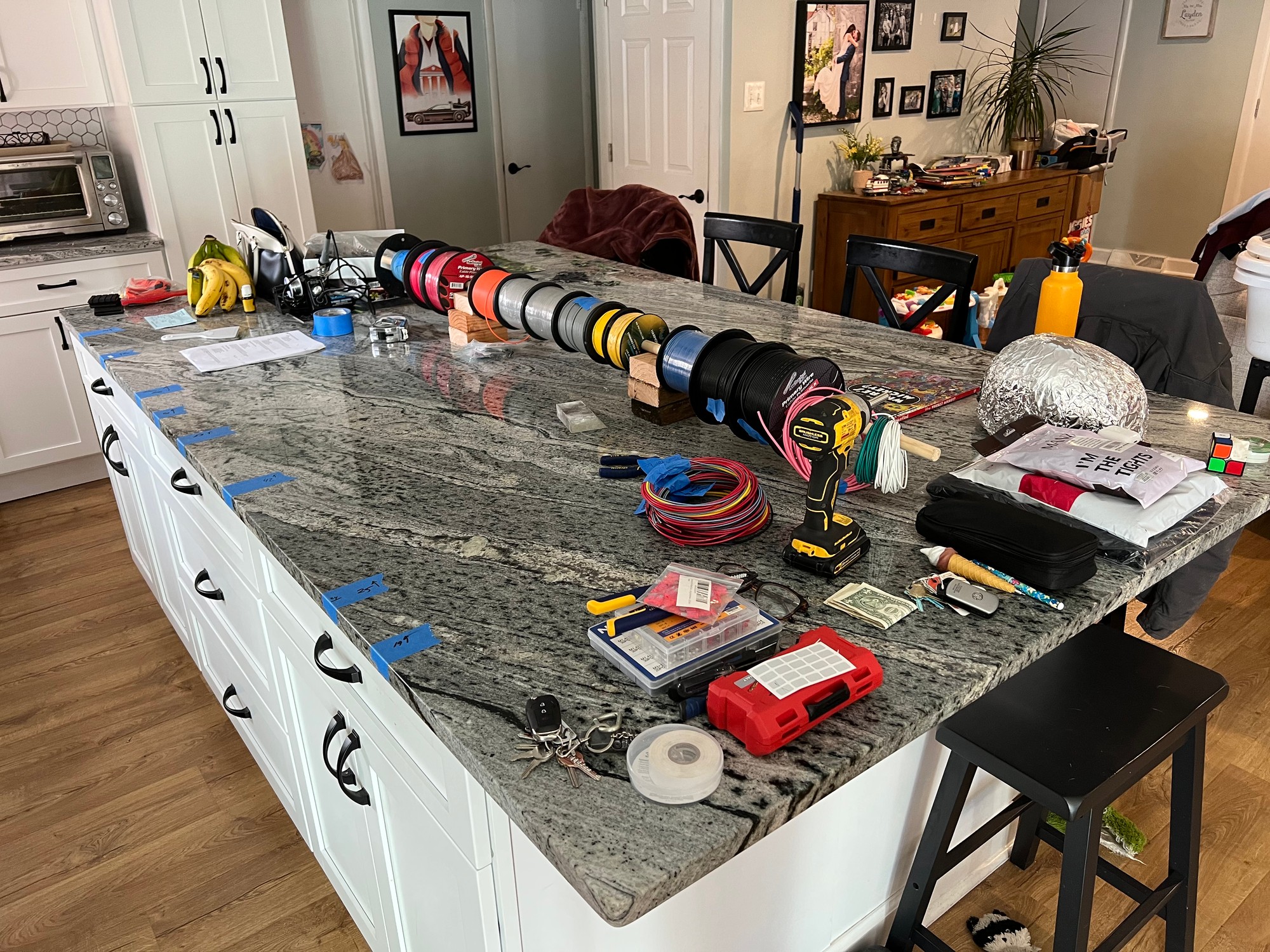 Every wire run pre-cut, labeled, and coiled on the kitchen island before going into the car