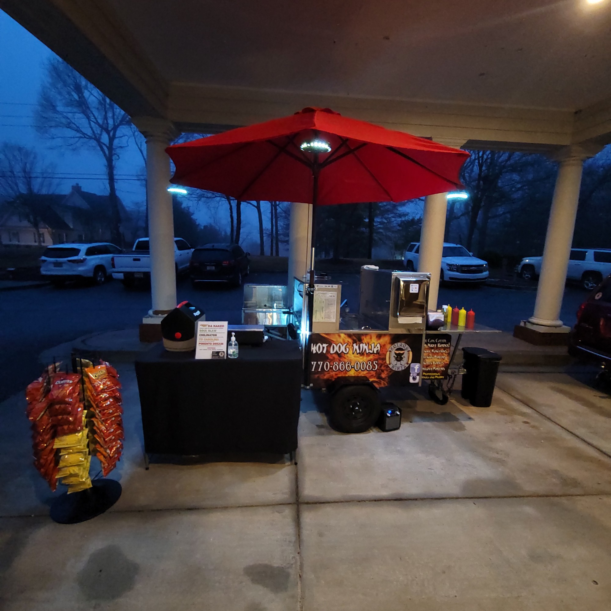 Hot Dog Ninja cart setup at evening catering event