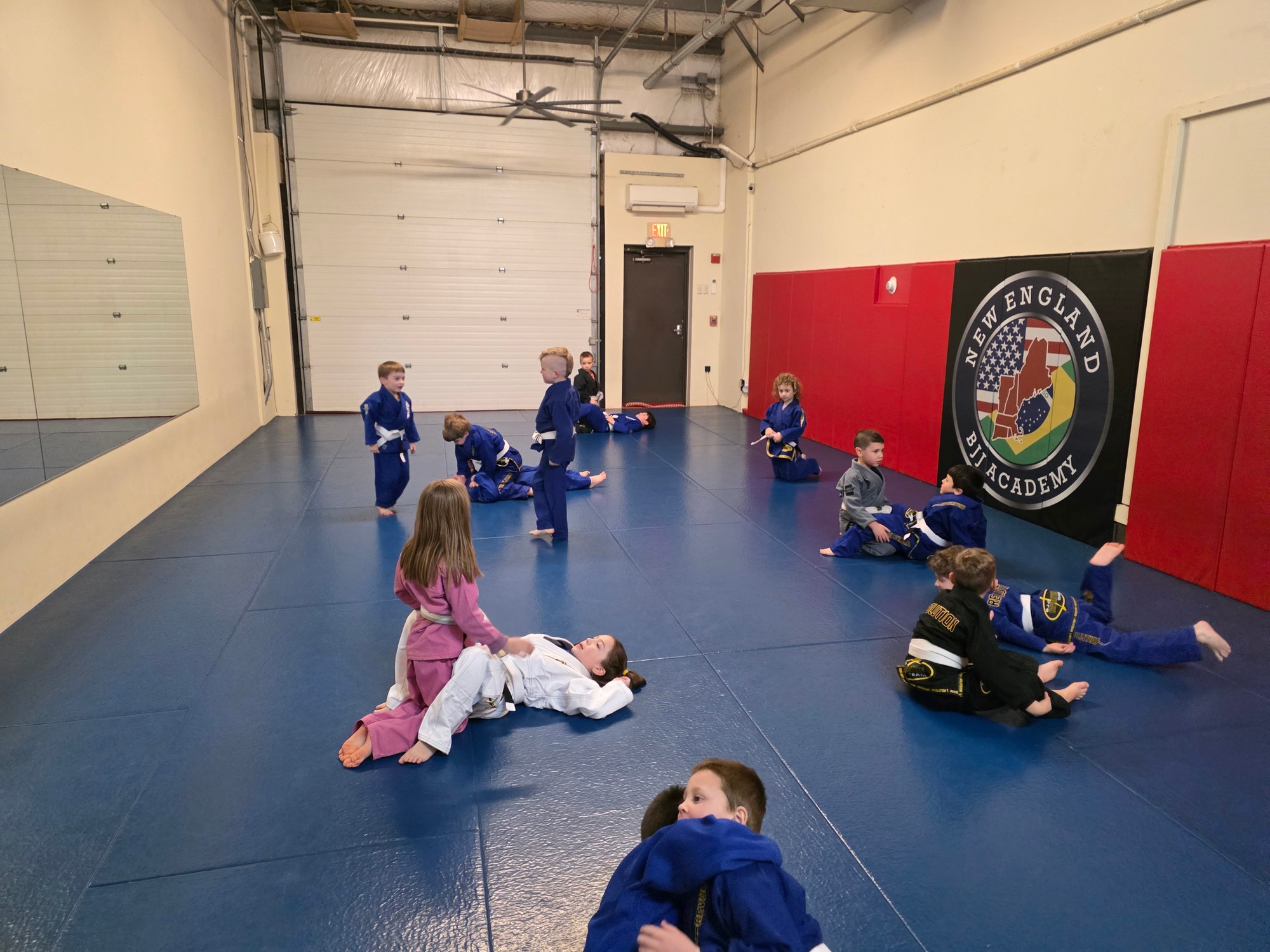 Kids practicing Brazilian Jiu-Jitsu together