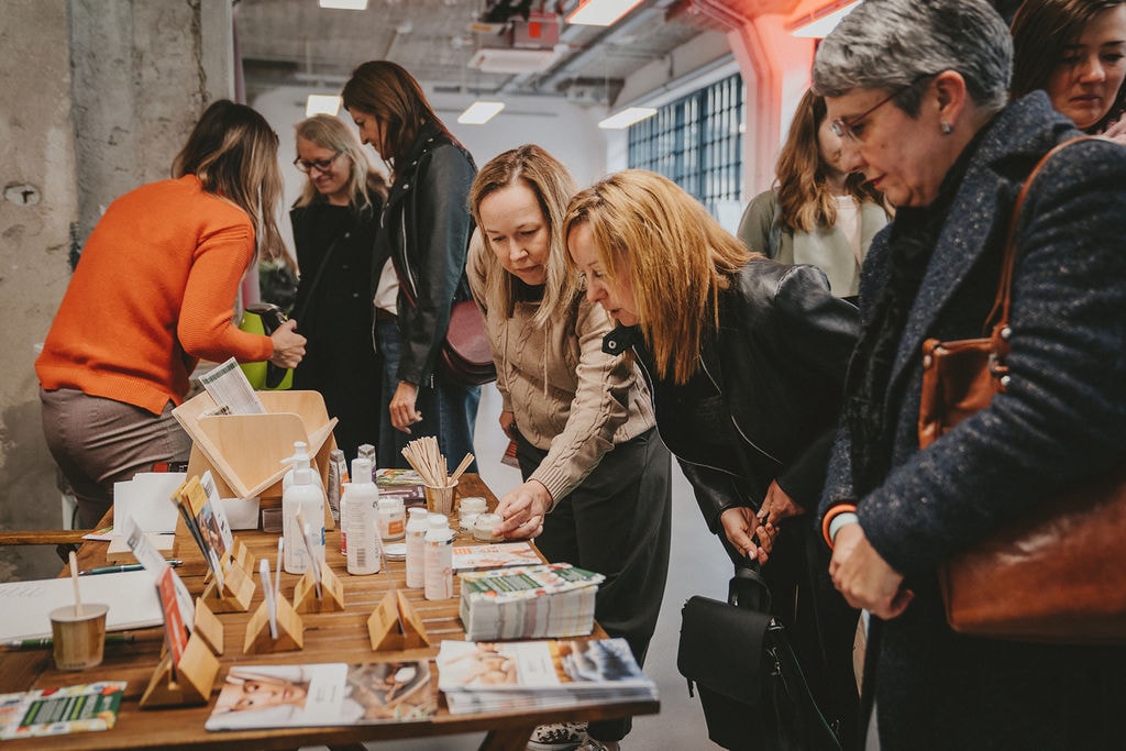 Visitors at an exhibitor stand