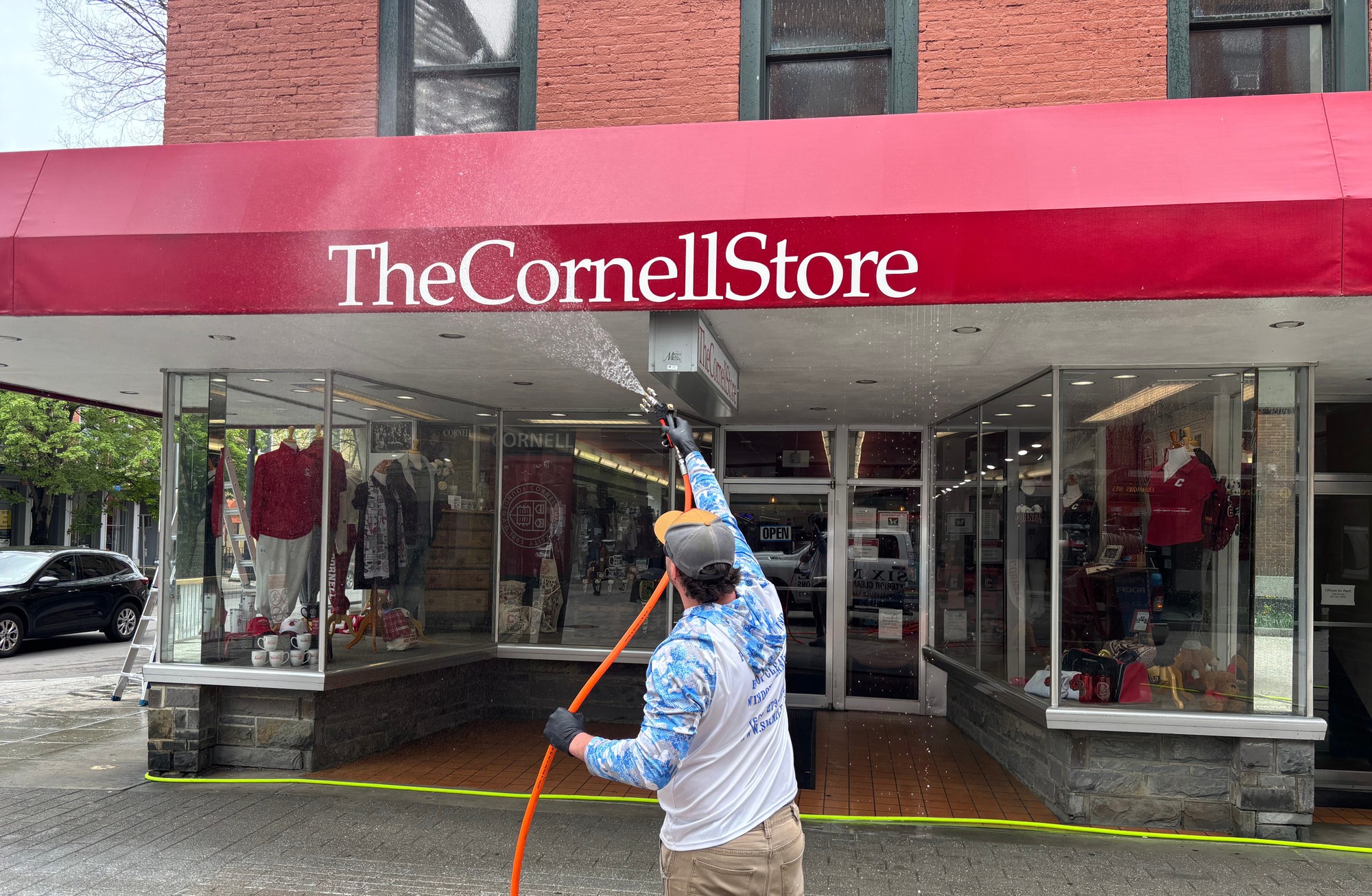 Six Mile team member cleaning The Cornell Store in Ithaca