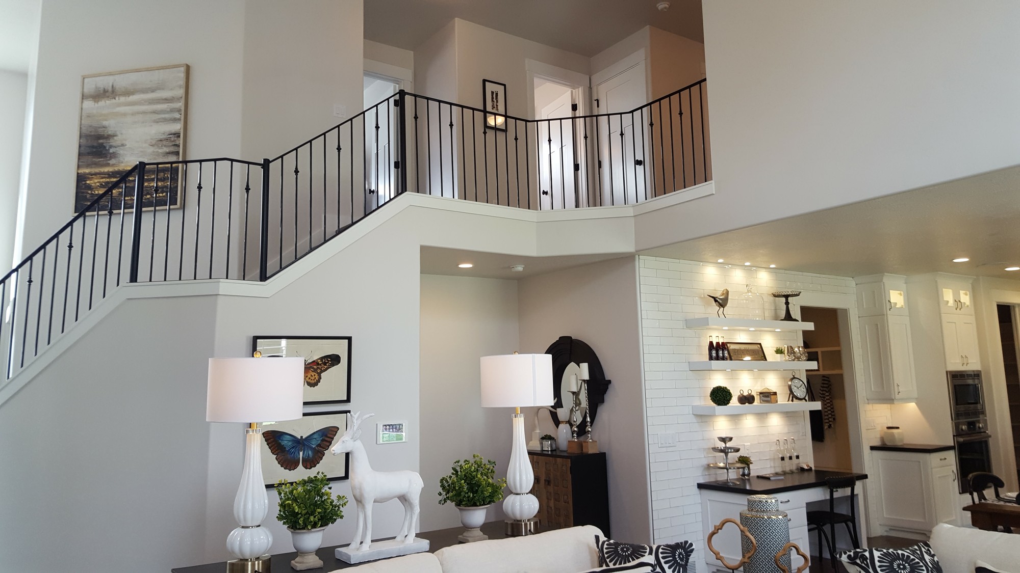 Custom iron stair railing and open foyer — B&N Construction