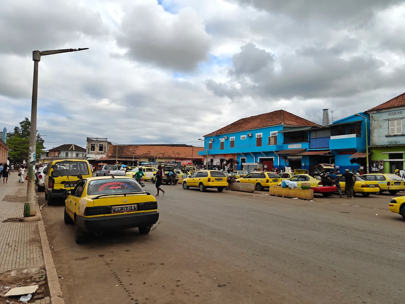 Yellow Hiace minibus on a road in São Tomé