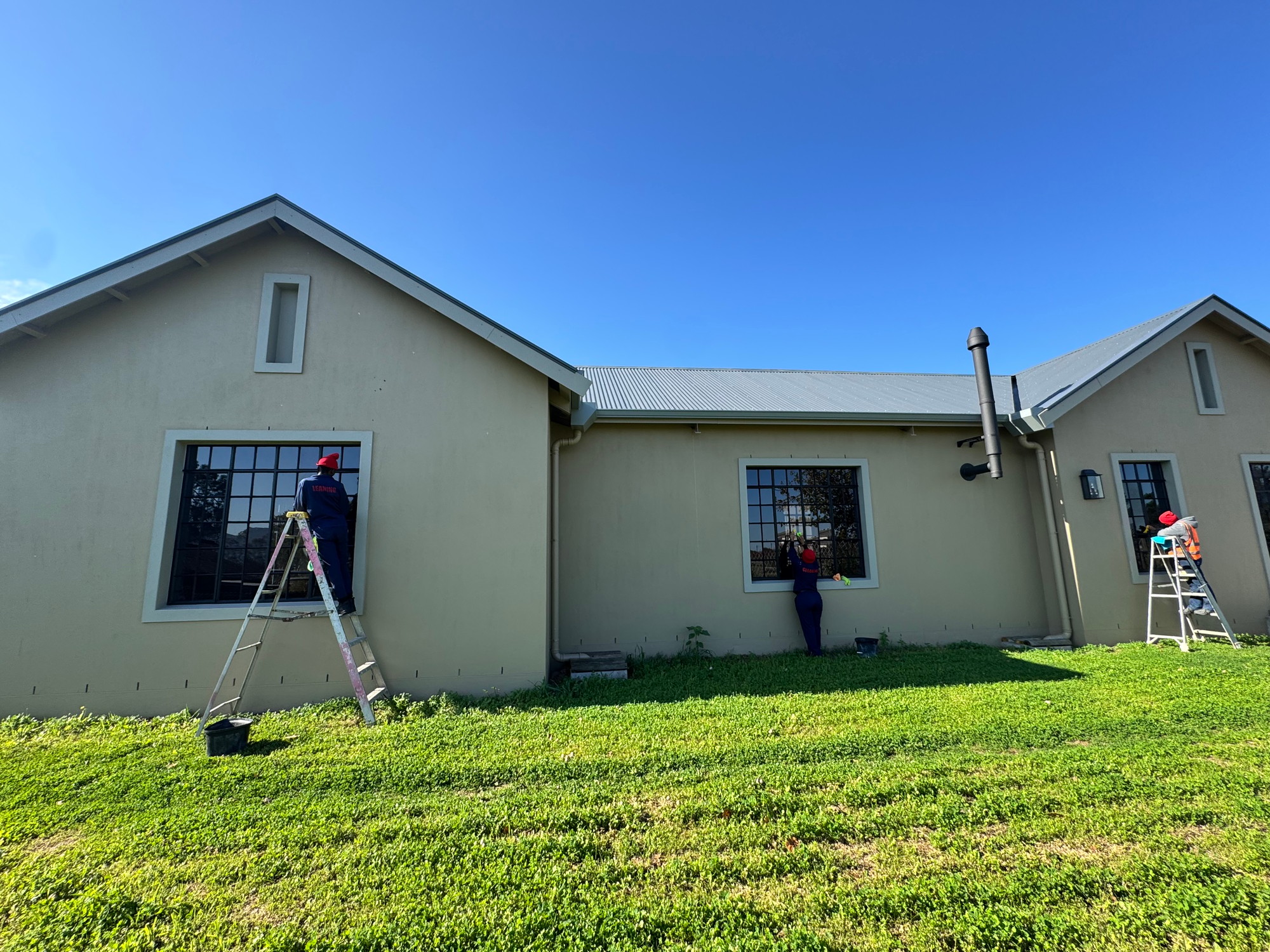 Team Cleaning New House Windows