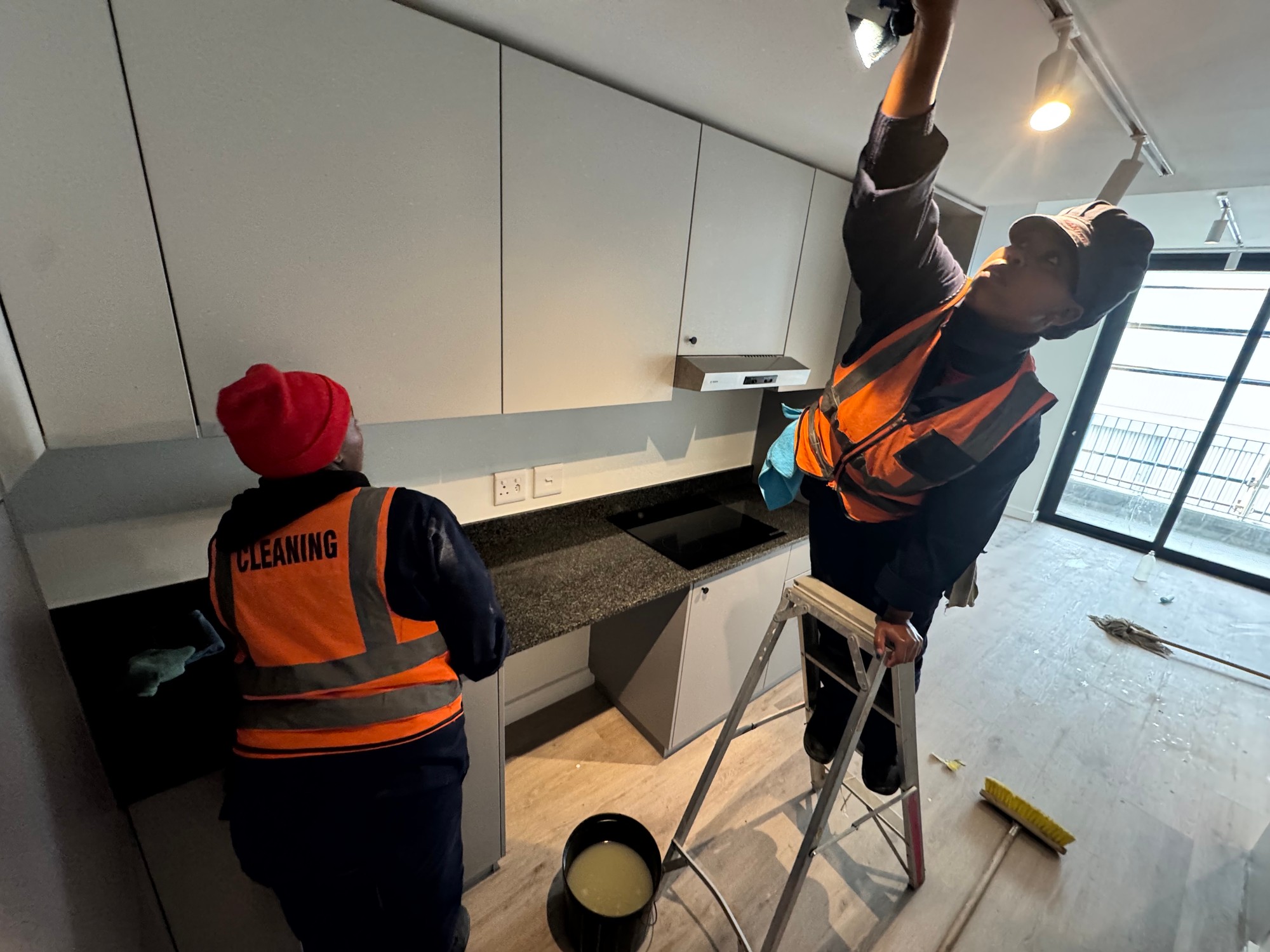 Team Cleaning Ceiling Lights