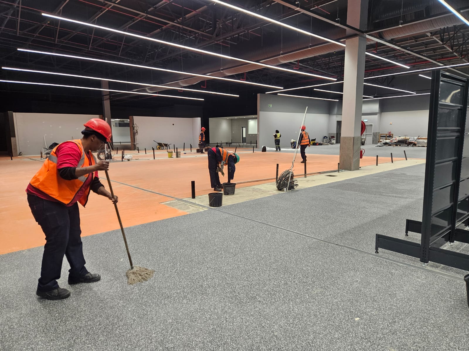 Hygiene Kleen team cleaning warehouse floor