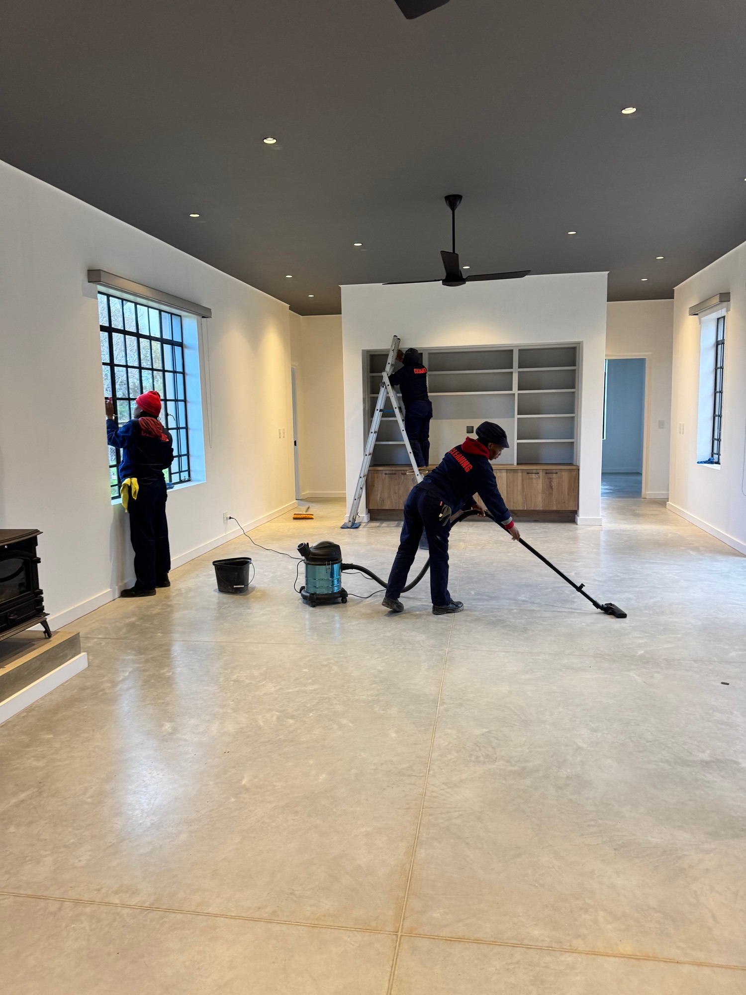 Team Vacuuming New Home