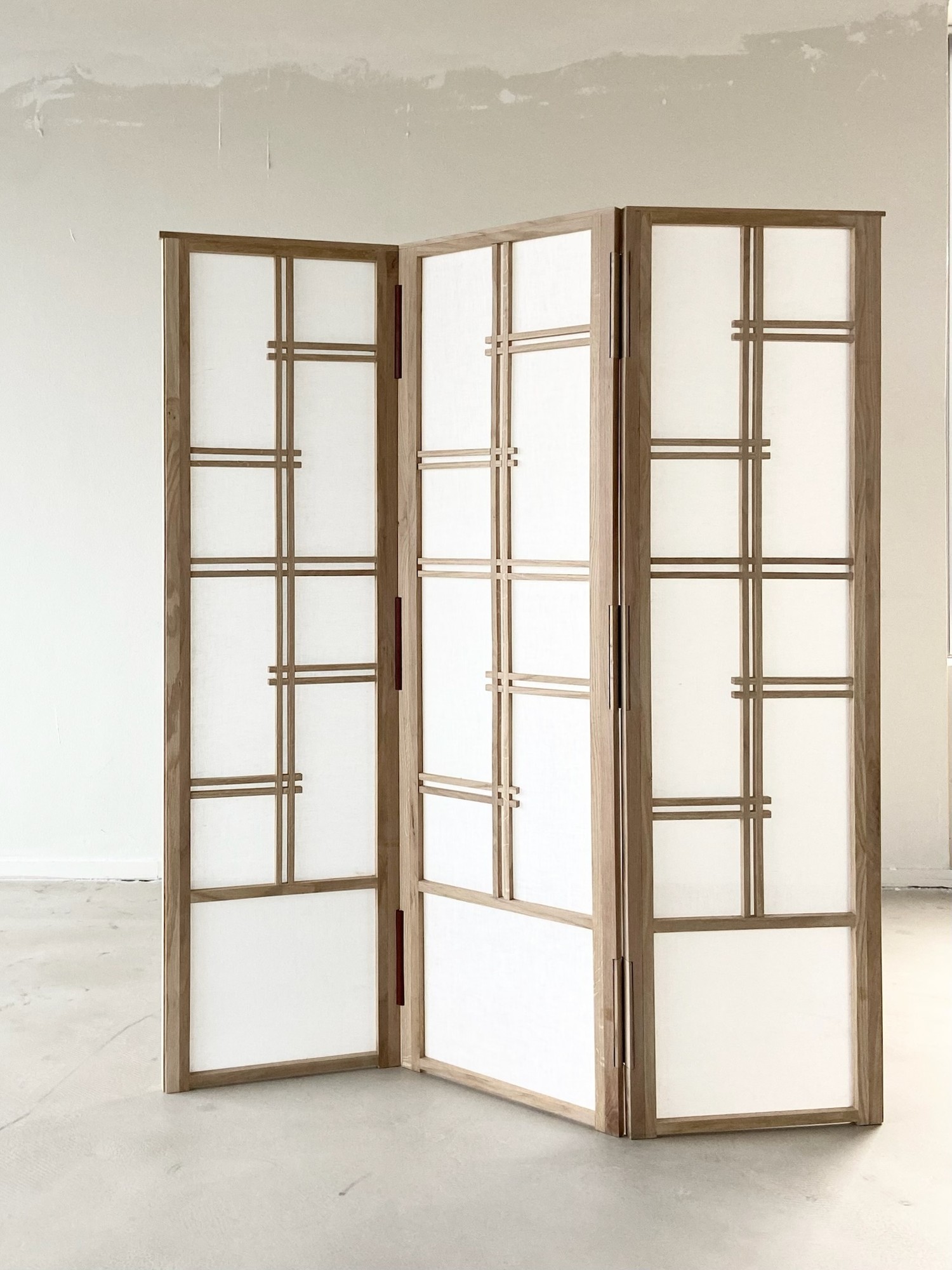 Leather binding detail joining the LINFIN room divider panels