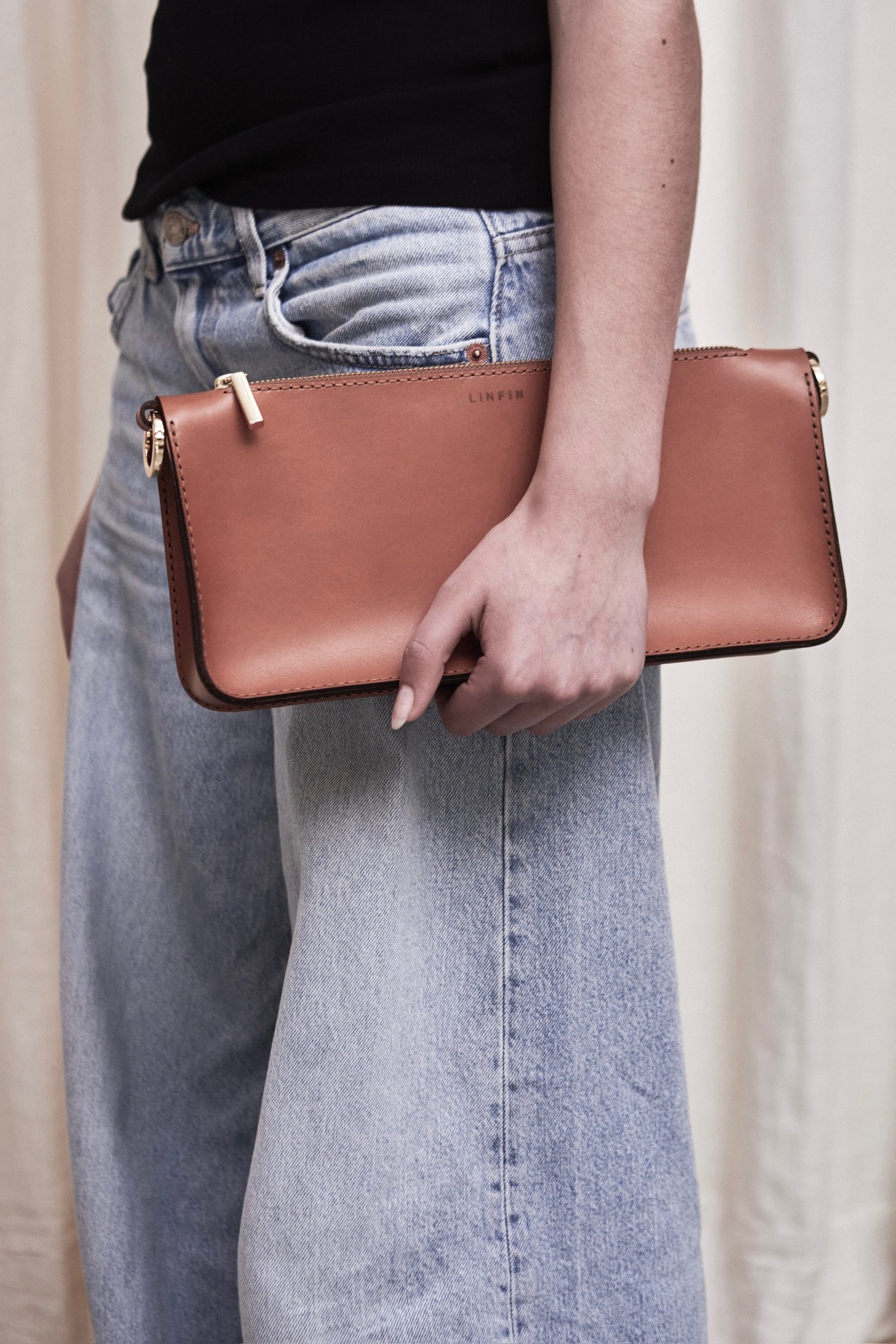 Vegetable-tanned leather bag with patina and natural texture