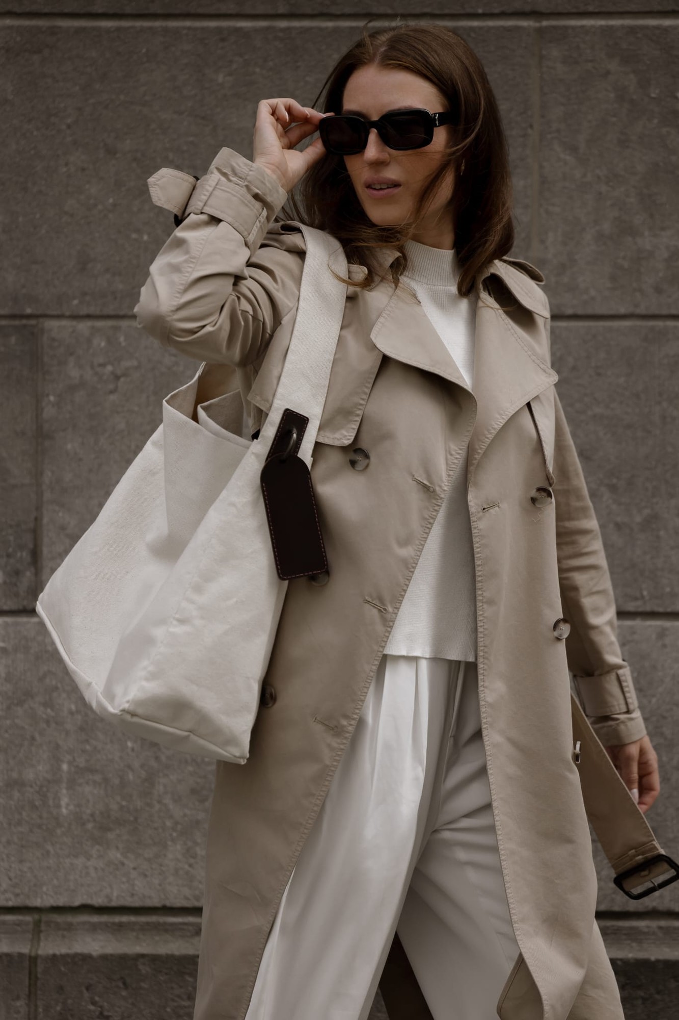 MAIIT linen tote worn over the shoulder with a beige trench coat