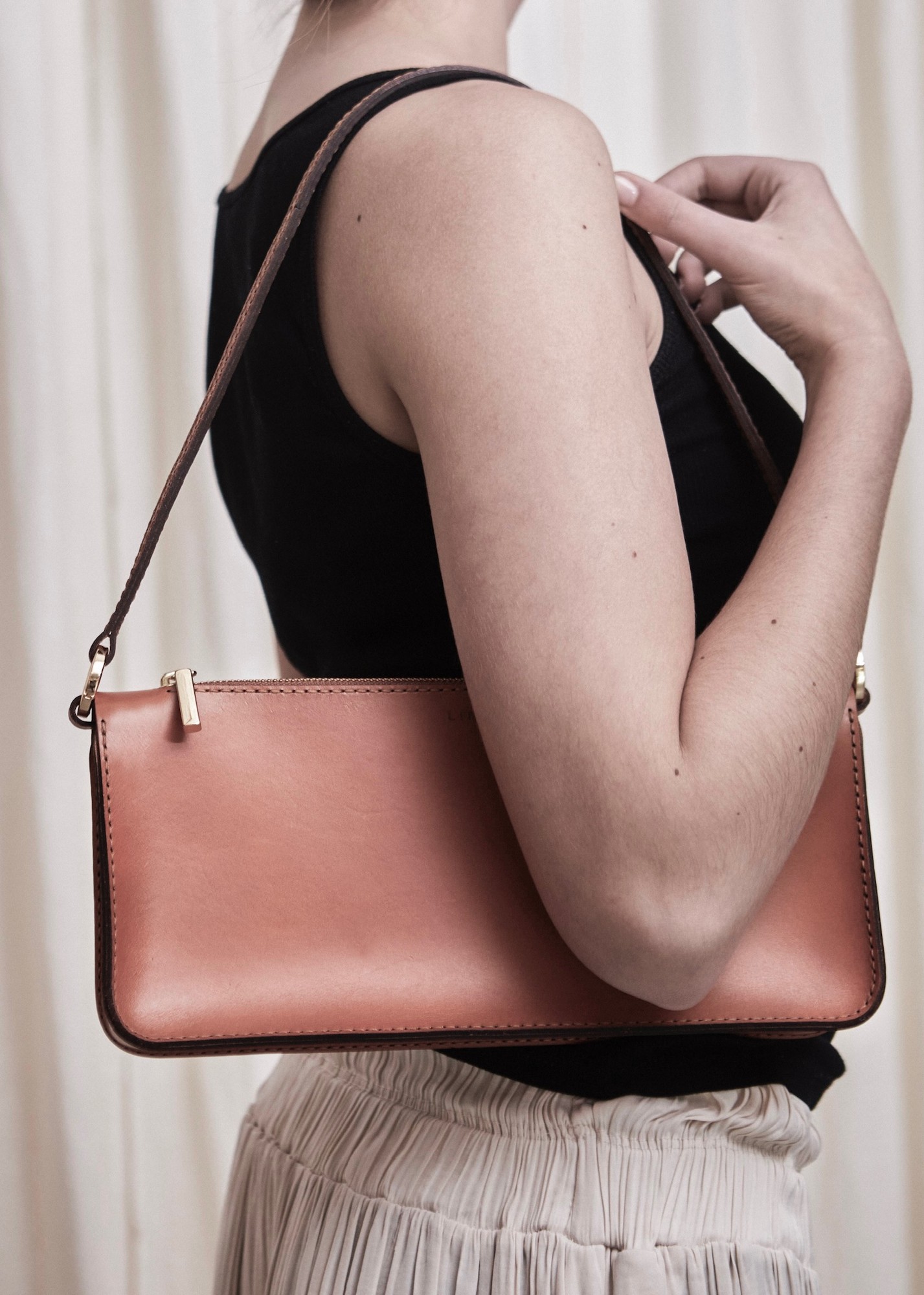 Close-up of hand-stitched leather bag detail
