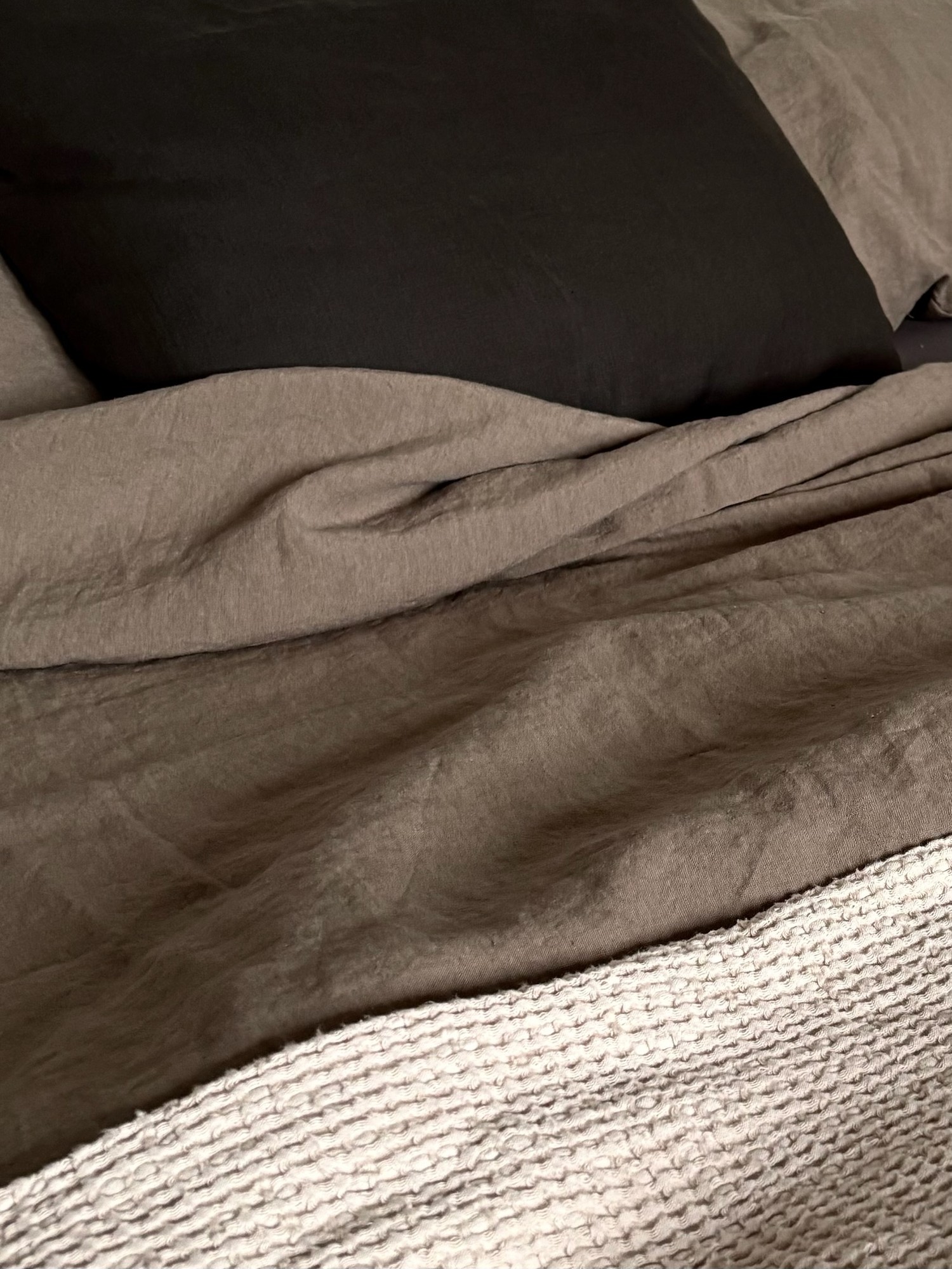Linen Duvet Cover draped across the bed in soft daylight