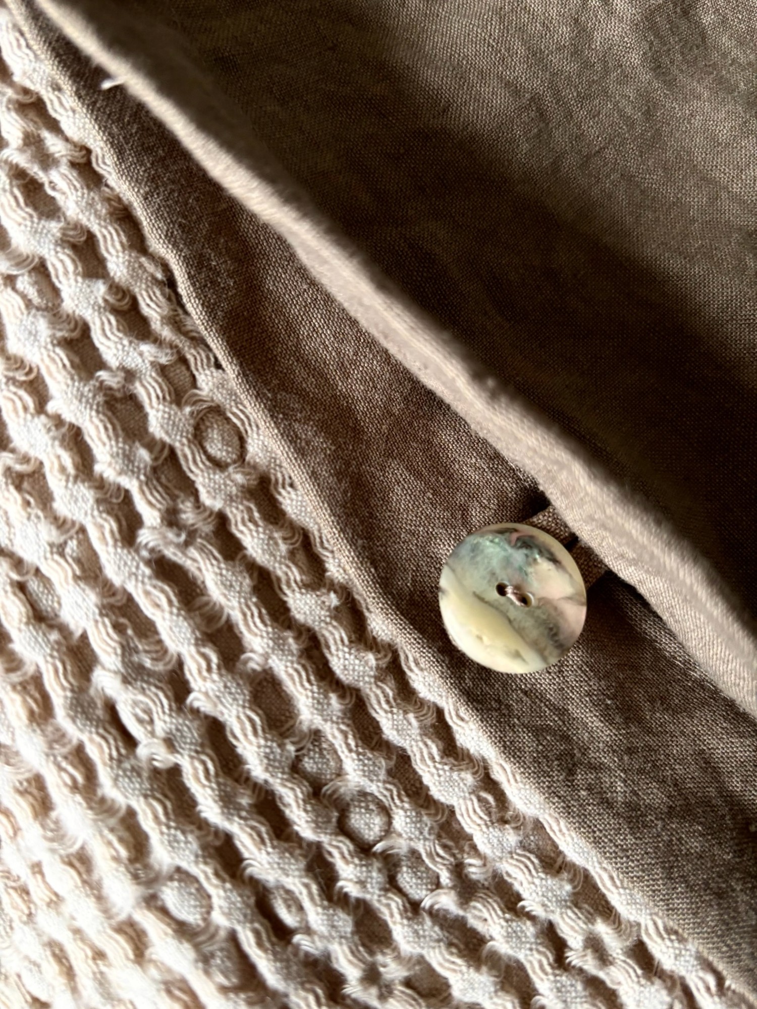 Detail of the linen duvet cover edge and seam finishing