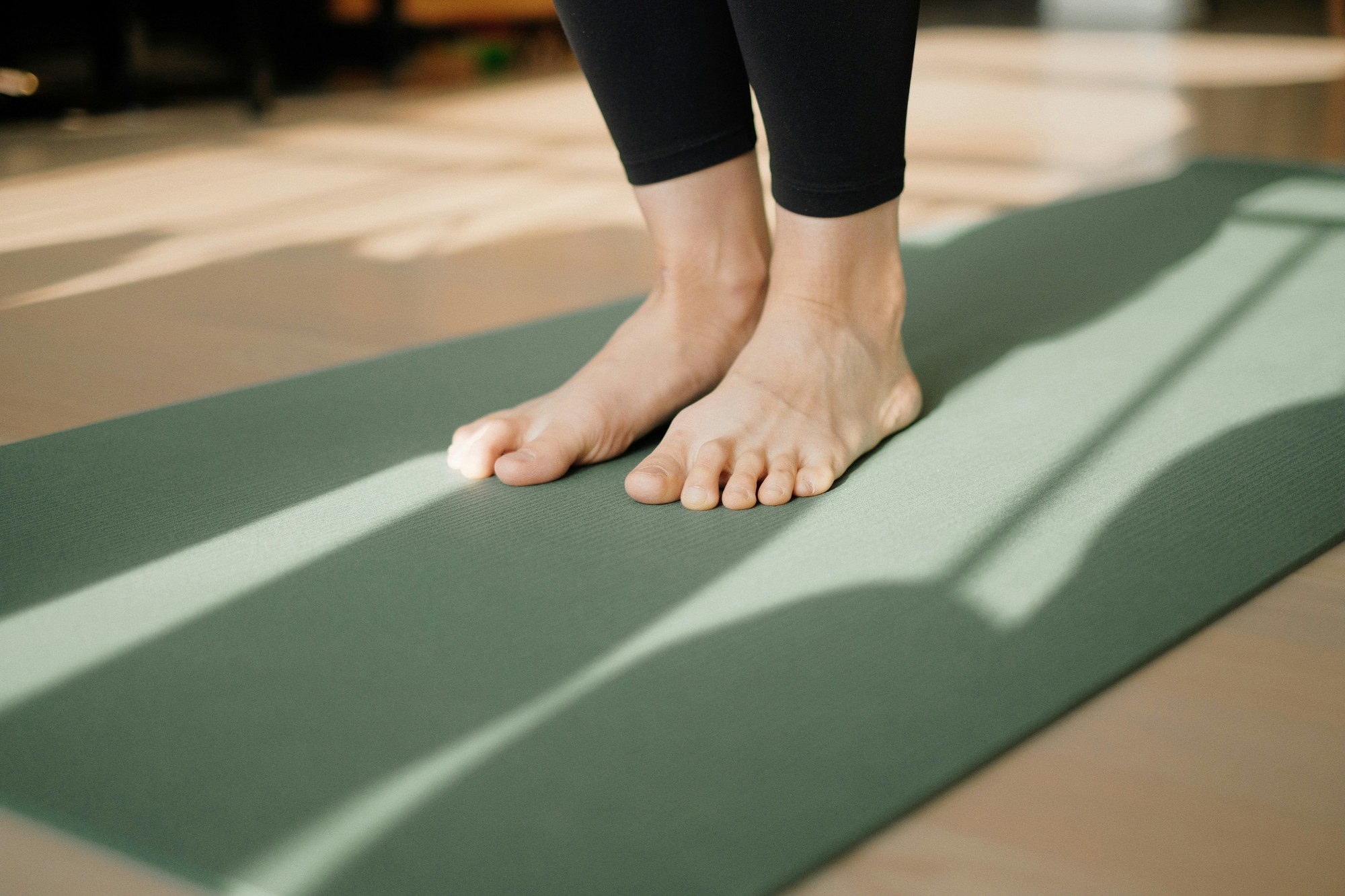 A student standing on a mat in the practice room